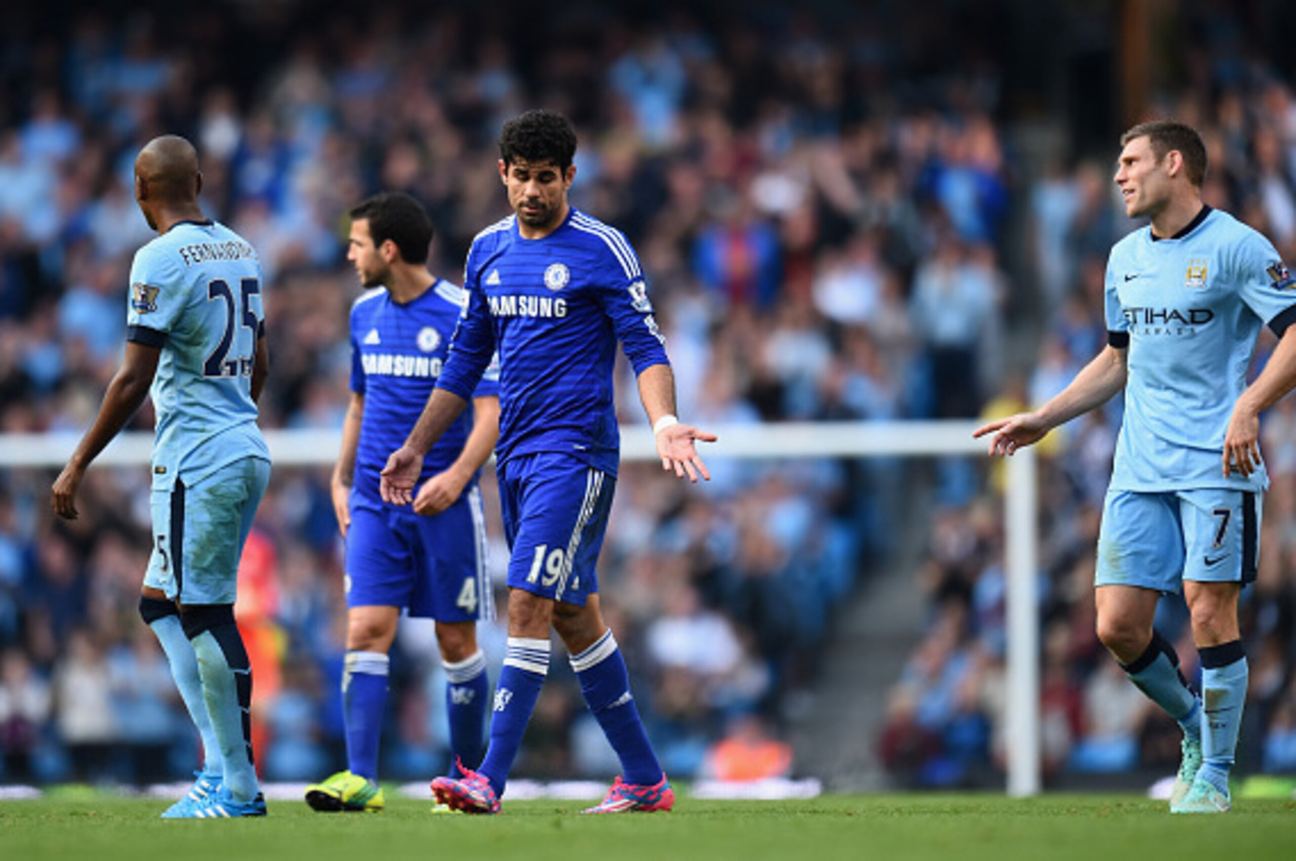 MANCHESTER, ENGLAND - SEPTEMBER 21:  Diego Costa of Chelsea reacts to James Milner of Manchester City following the red card during the Barclays Premier League match between Manchester City and Chelsea at the Etihad Stadium on September 21, 2014 in Manche