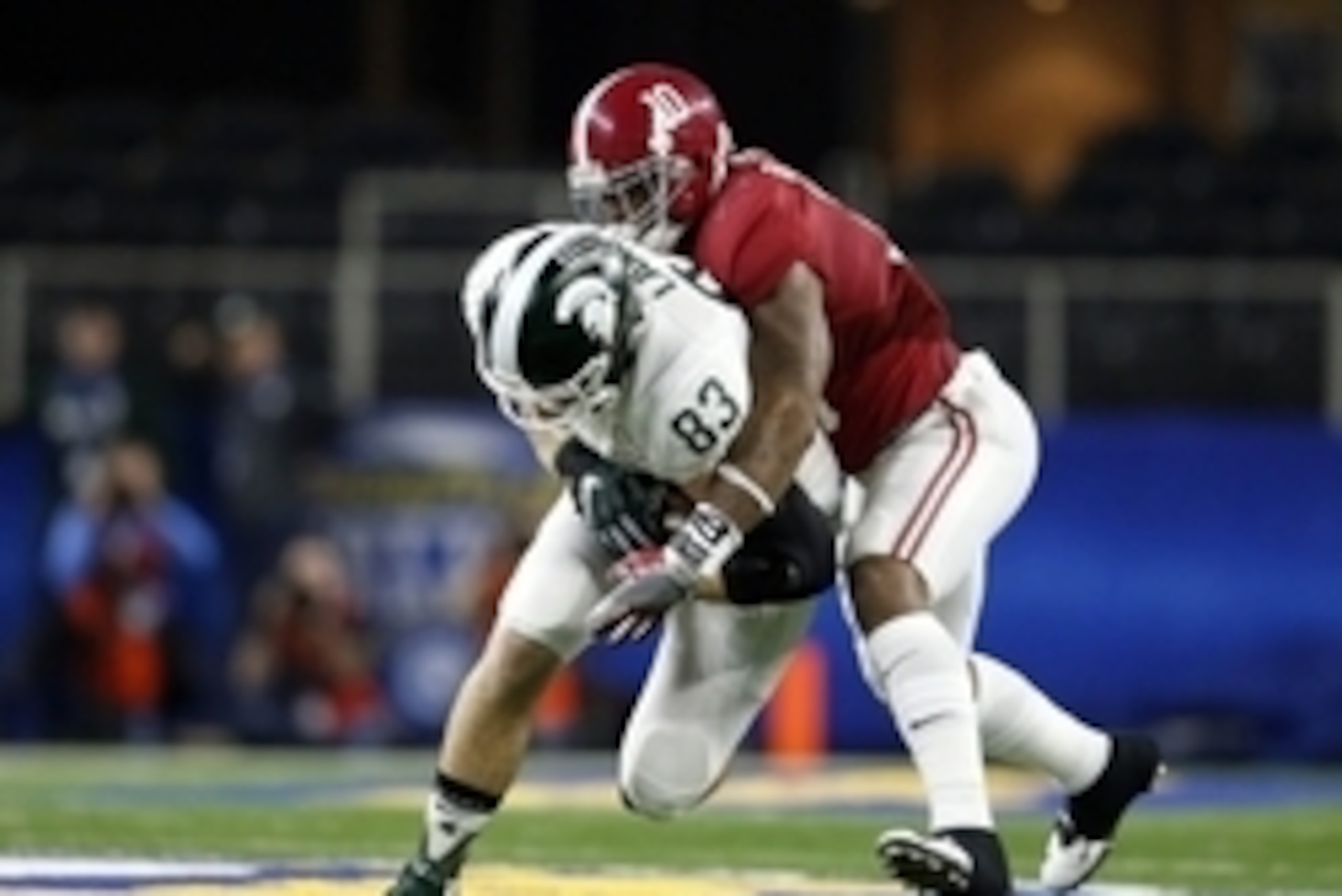 Dec 31, 2015; Arlington, TX, USA; Michigan State Spartans tight end Paul Lang (83) is tackled by Alabama Crimson Tide linebacker Reuben Foster (10) in the second quarter in the 2015 CFP semifinal at the Cotton Bowl at AT&T Stadium. Mandatory Credit: Matth Dec 31, 2015; Arlington, TX, USA; Michigan State Spartans tight end Paul Lang (83) is tackled by Alabama Crimson Tide linebacker Reuben Foster (10) in the second quarter in the 2015 CFP semifinal at the Cotton Bowl at AT&T Stadium. Mandatory Credit: Matth