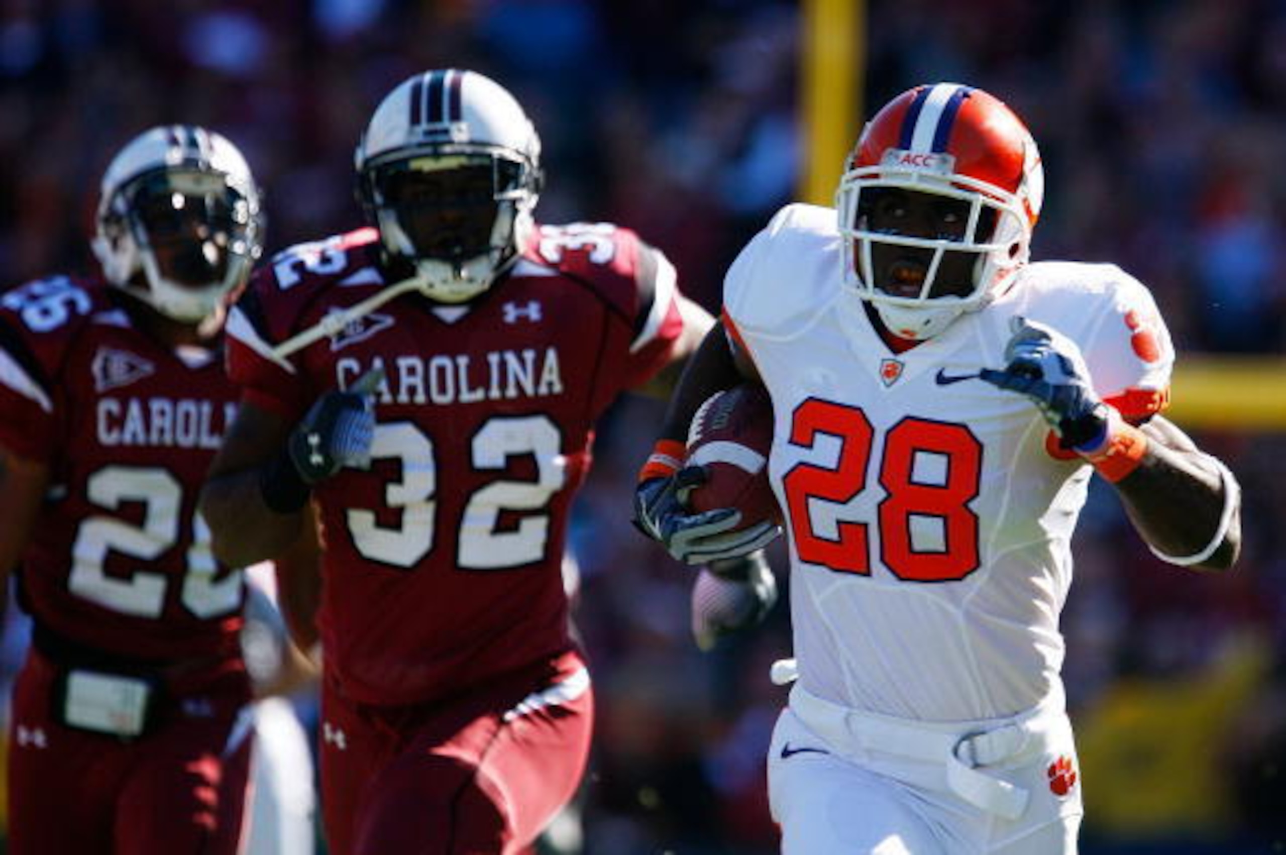 COLUMBIA, SC - NOVEMBER 28: C.J. Spiller #28 of the Clemson Tigers returns a kickoff past Antonio Allen #26 and Reginald Bowens #32 of the South Carolina Gamecocks for a first quarter touchdown at Williams-Brice Stadium on November 28, 2009 in Columbia, COLUMBIA, SC - NOVEMBER 28: C.J. Spiller #28 of the Clemson Tigers returns a kickoff past Antonio Allen #26 and Reginald Bowens #32 of the South Carolina Gamecocks for a first quarter touchdown at Williams-Brice Stadium on November 28, 2009 in Columbia,