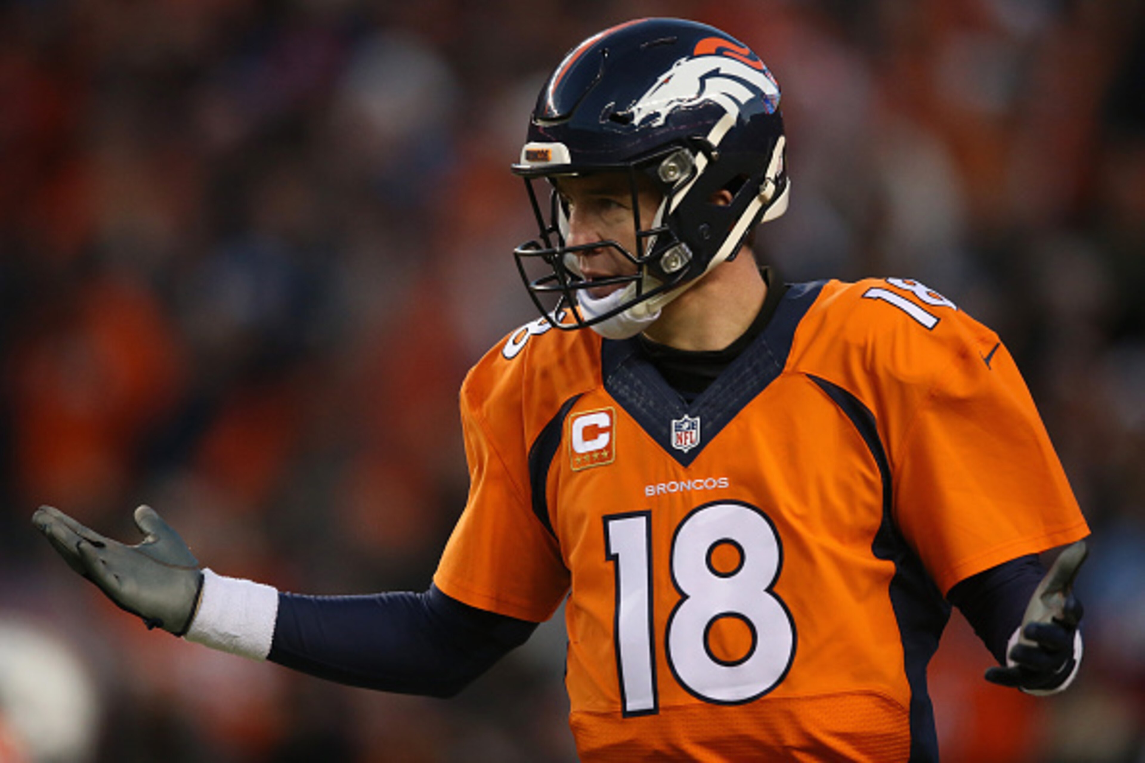 DENVER, CO - JANUARY 03:  Quarterback Peyton Manning #18 of the Denver Broncos reacts after a one yard touchdown run by C.J. Anderson #22 of the Denver Broncos to take a 14-13 lead over the San Diego Chargers in the third quarter at Sports Authority Field