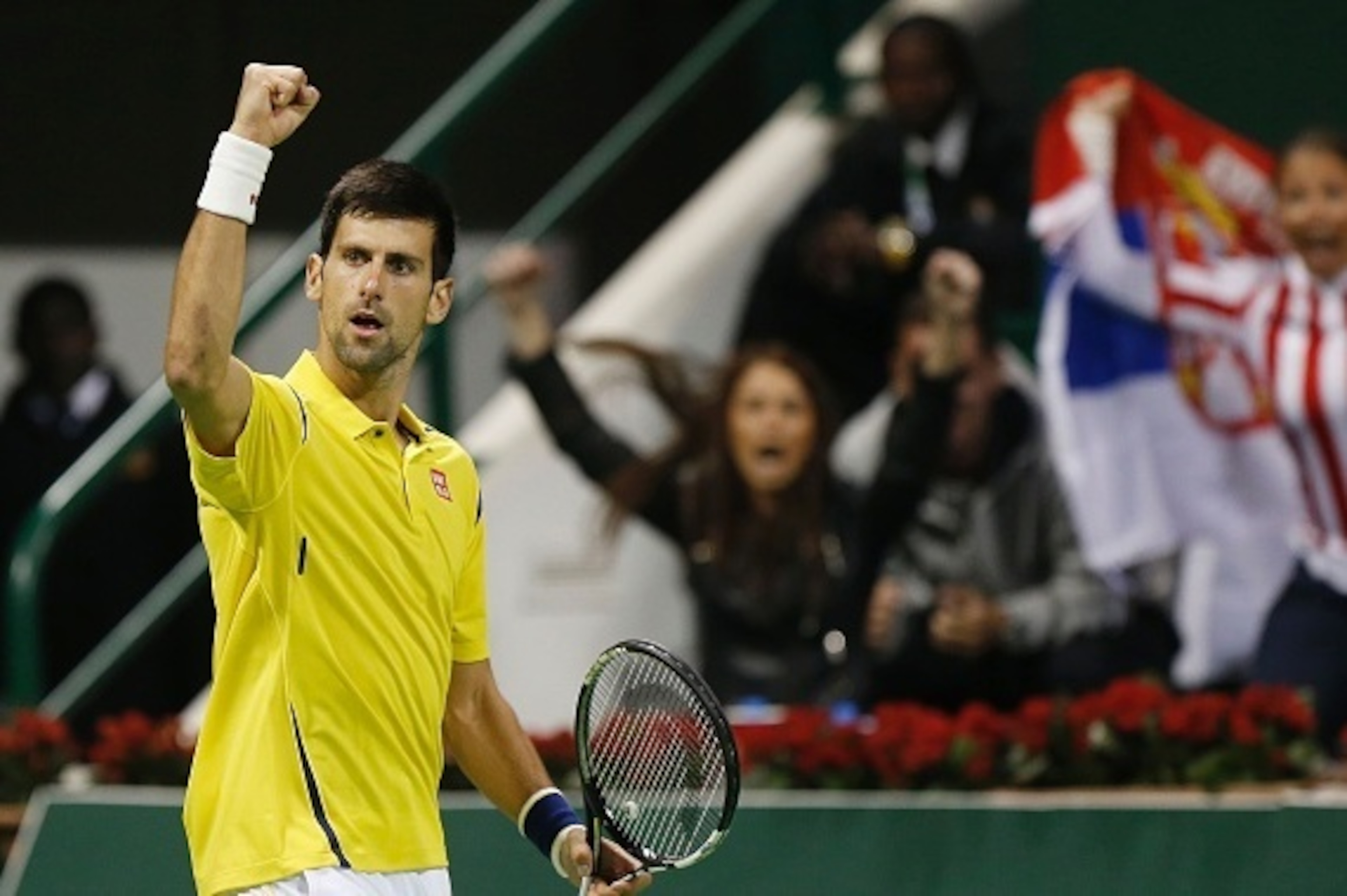 Novak Djokovic of Serbia celebrates after beating Argentina's Leonardo Mayer in their tennis match during the Qatar Open tournament on January 7, 2016, in Doha. Djokovic won the match 6-3, 7-5. AFP PHOTO / KARIM JAAFAR / AFP / KARIM JAAFAR        (Photo c
