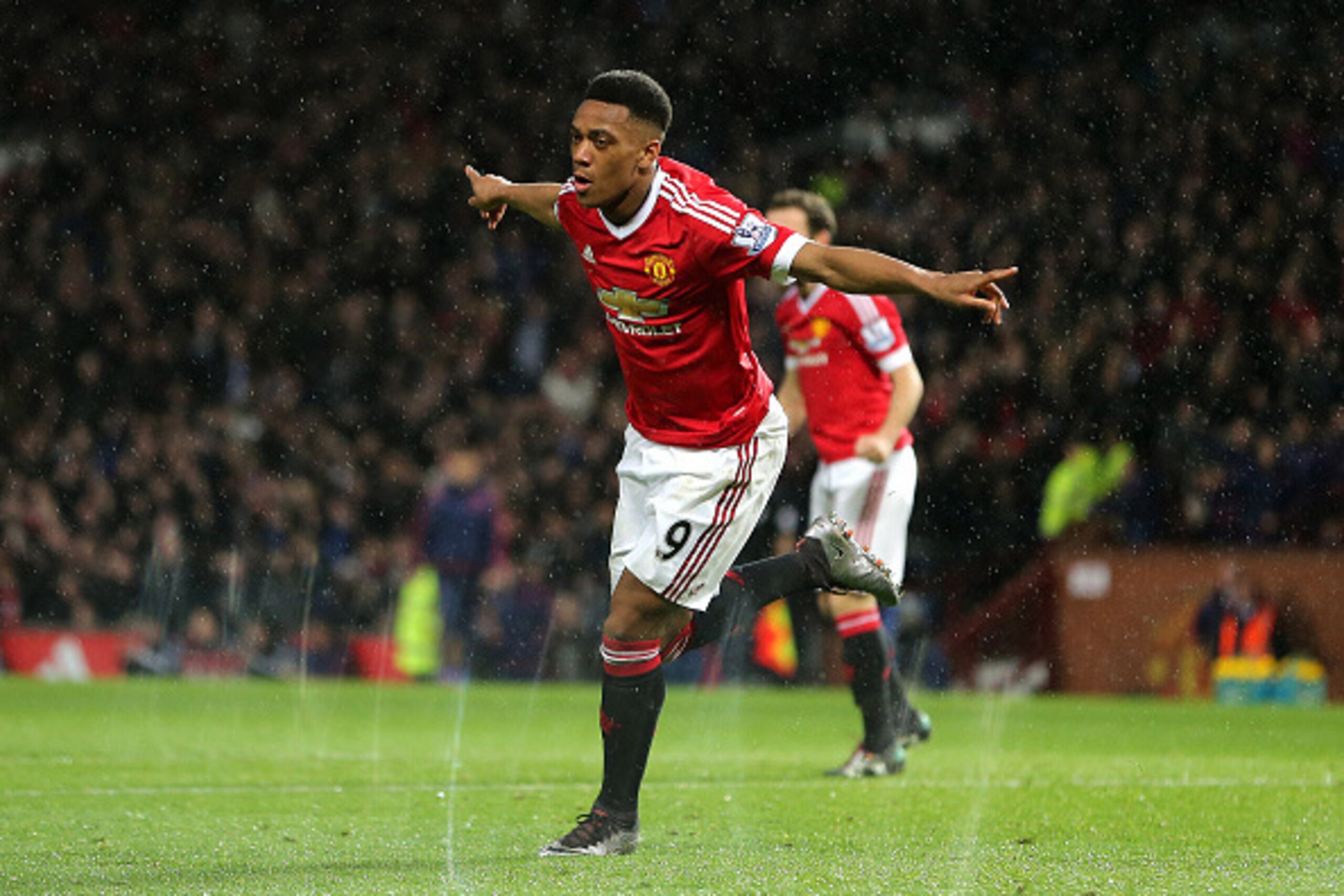 MANCHESTER, ENGLAND - JANUARY 02: Anthony Martial of Manchester United celebrates after scoring a goal to make it 1-0 during the Barclays Premier League match between Manchester United and Swansea City at Old Trafford on January 2, 2016 in Manchester, Eng