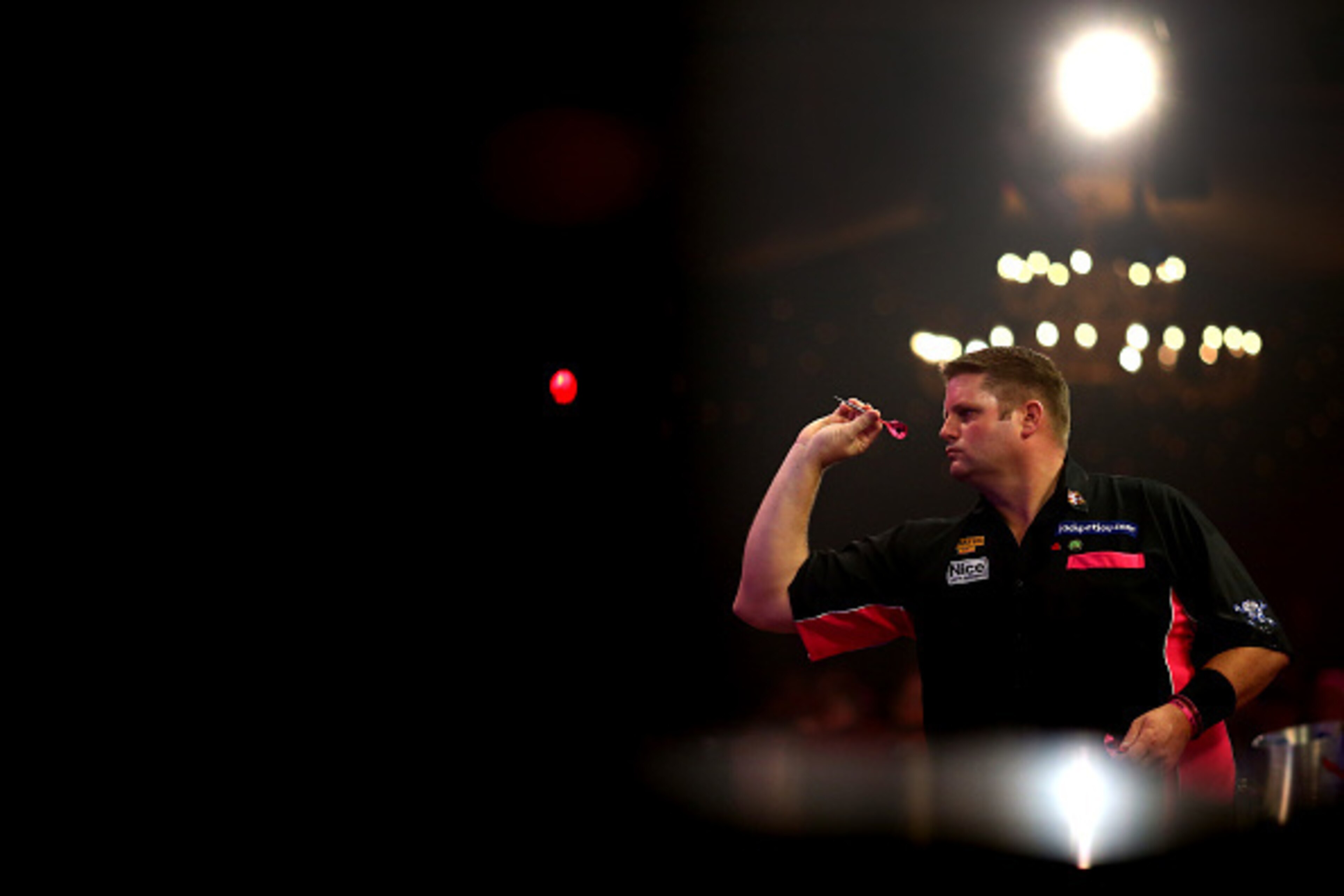 FRIMLEY, ENGLAND - JANUARY 11: Scott Mitchell of England in action during the mens final against Martin Adams of England during the BDO Lakeside World Professional Darts Championships on Day Nine at The Lakeside Country Club on January 11, 2015 in Frimley