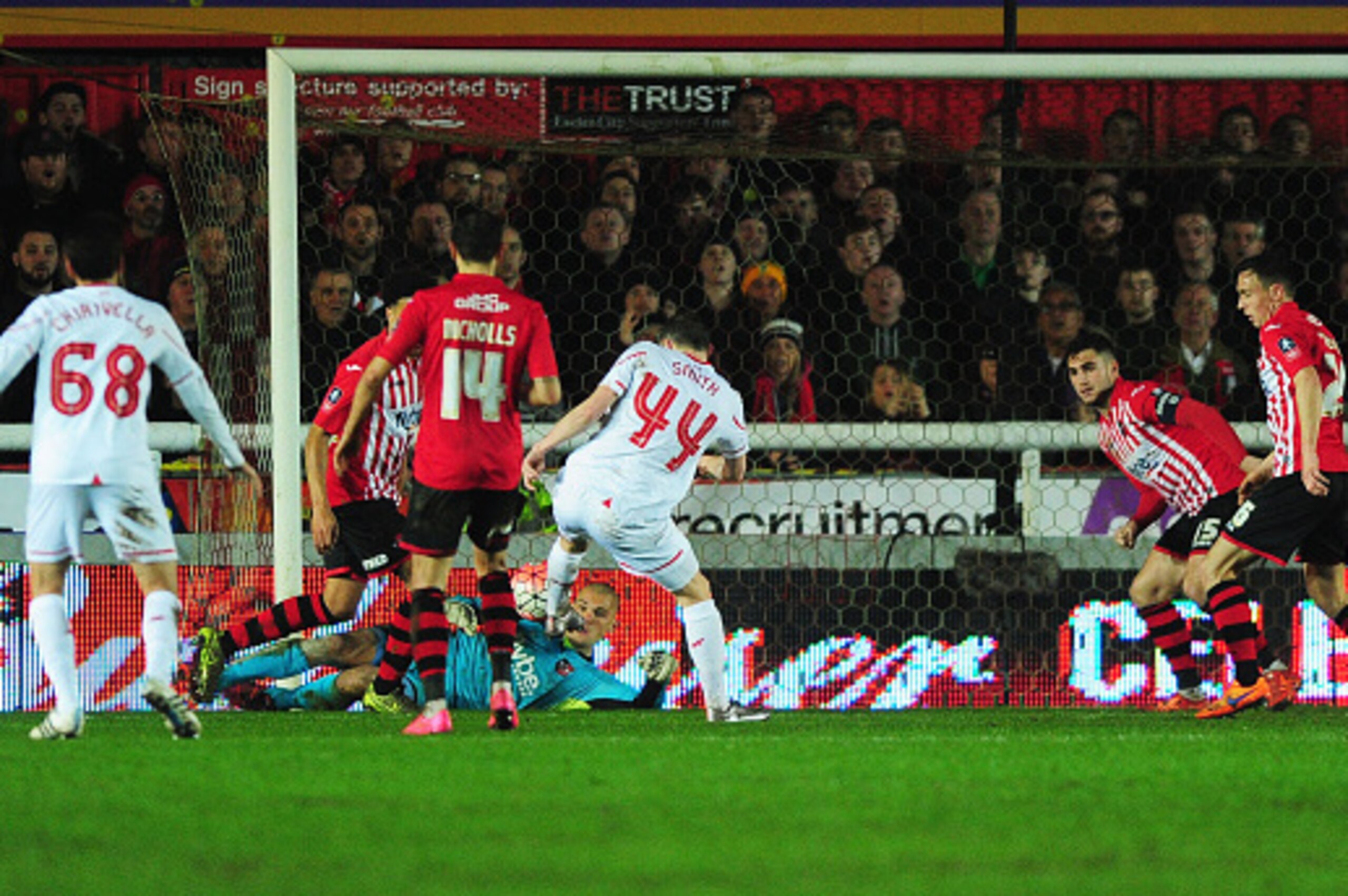 EXETER, ENGLAND - JANUARY 08:  Brad Smith of Liverpool (44) scores their second goal during the Emirates FA Cup third round match between Exeter City and Liverpool at St James Park on January 8, 2016 in Exeter, England.  (Photo by Dan Mullan/Getty Images)