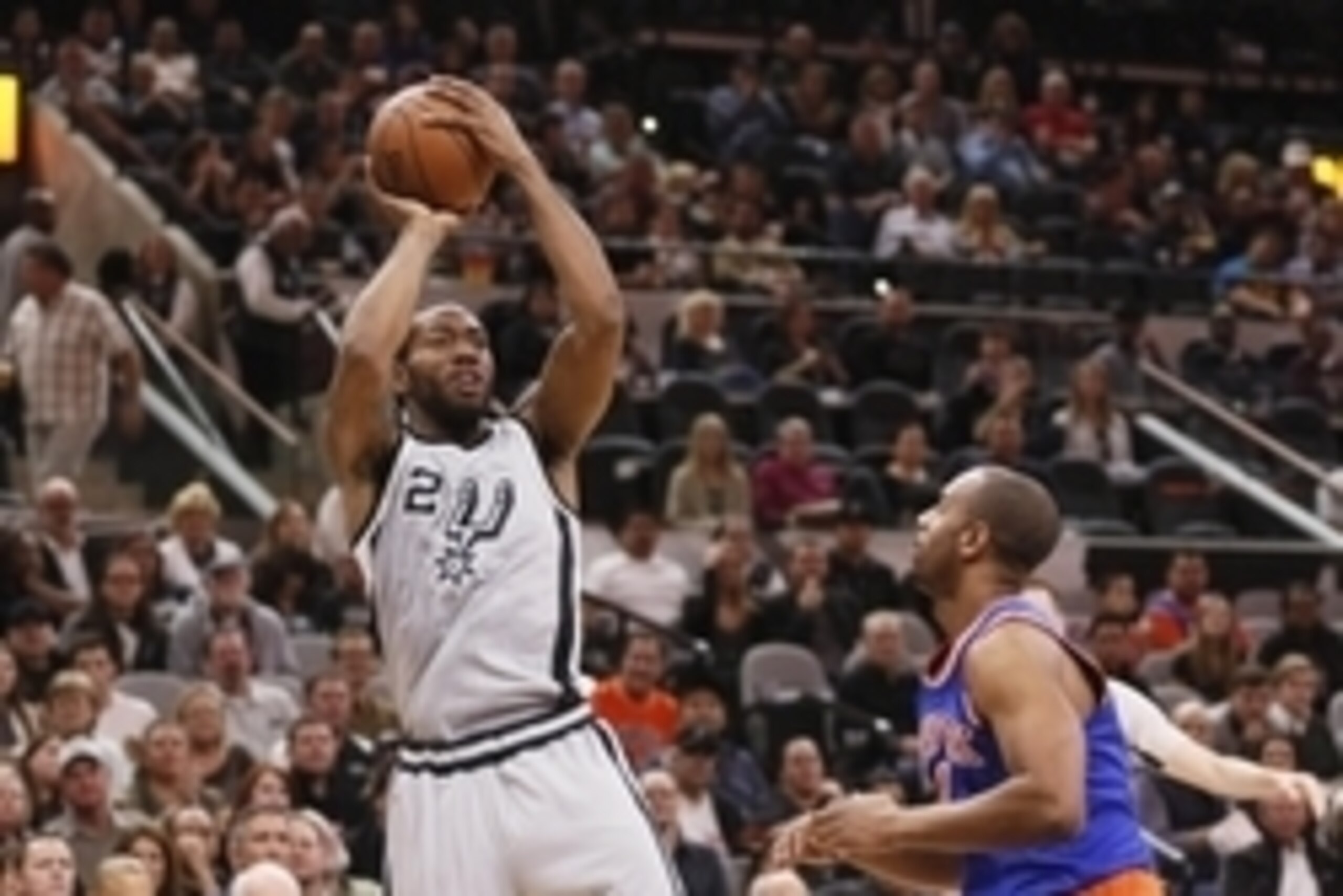 Jan 8, 2016; San Antonio, TX, USA; San Antonio Spurs small forward Kawhi Leonard (2) shoots the ball over New York Knicks shooting guard Arron Afflalo (right) during the first half at AT&T Center. Mandatory Credit: Soobum Im-USA TODAY Sports