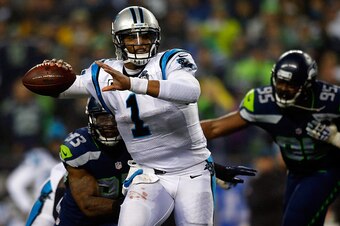 SEATTLE, WA - JANUARY 10:  Cam Newton #1 of the Carolina Panthers in action against the Seattle Seahawks during the 2015 NFC Divisional Playoff game at CenturyLink Field on January 10, 2015 in Seattle, Washington.  (Photo by Jonathan Ferrey/Getty Images)