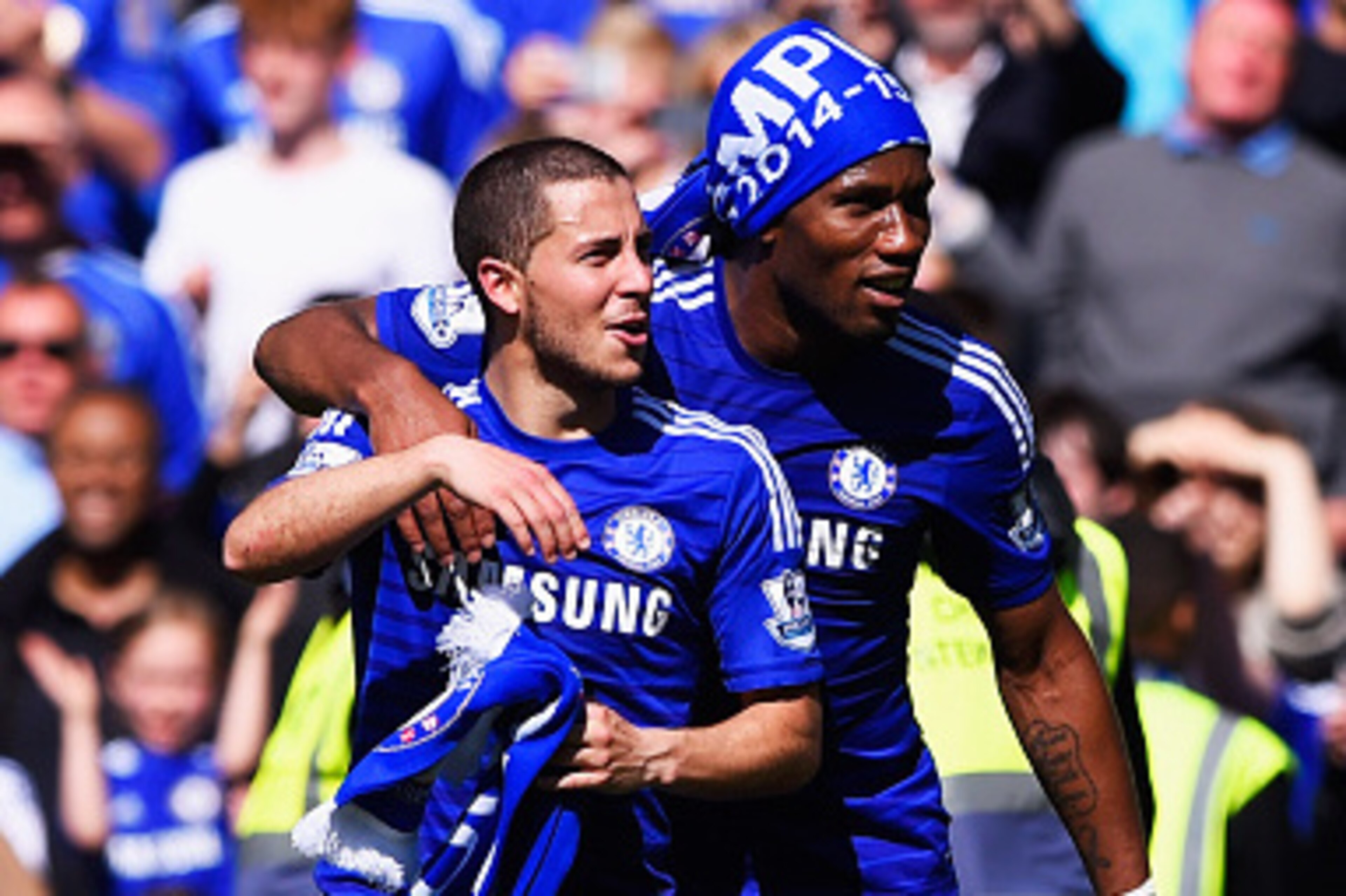 LONDON, ENGLAND - MAY 03:  Eden Hazard (L) and Didier Drogba of Chelsea celebrate winning the Premier League title after the Barclays Premier League match between Chelsea and Crystal Palace at Stamford Bridge on May 3, 2015 in London, England. Chelsea bec