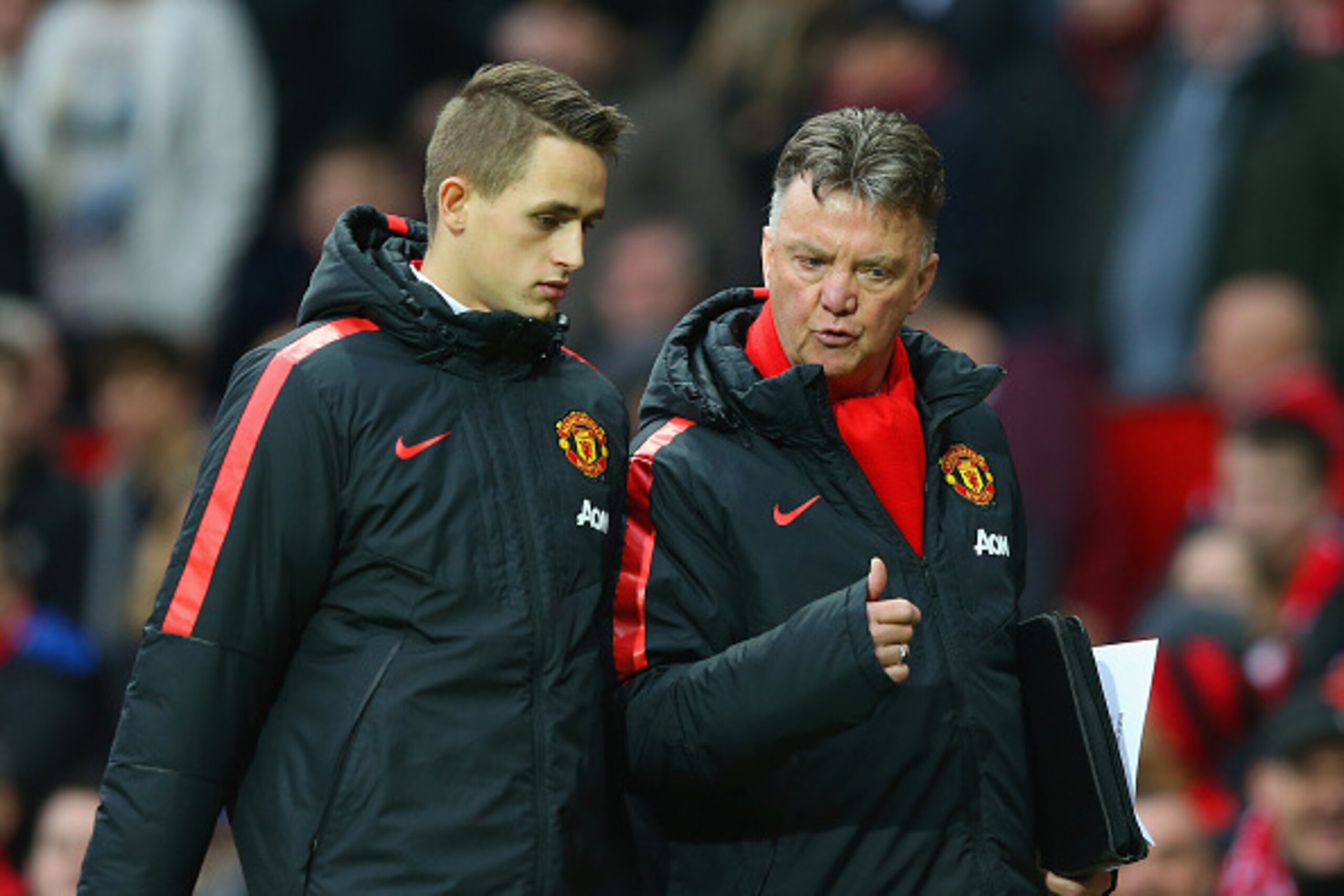 MANCHESTER, ENGLAND - FEBRUARY 28:  Manager Louis van Gaal of Manchester United speaks to Adnan Januzaj of Manchester United atr half time during the Barclays Premier League match between Manchester United and Sunderland at Old Trafford on February 28, 20