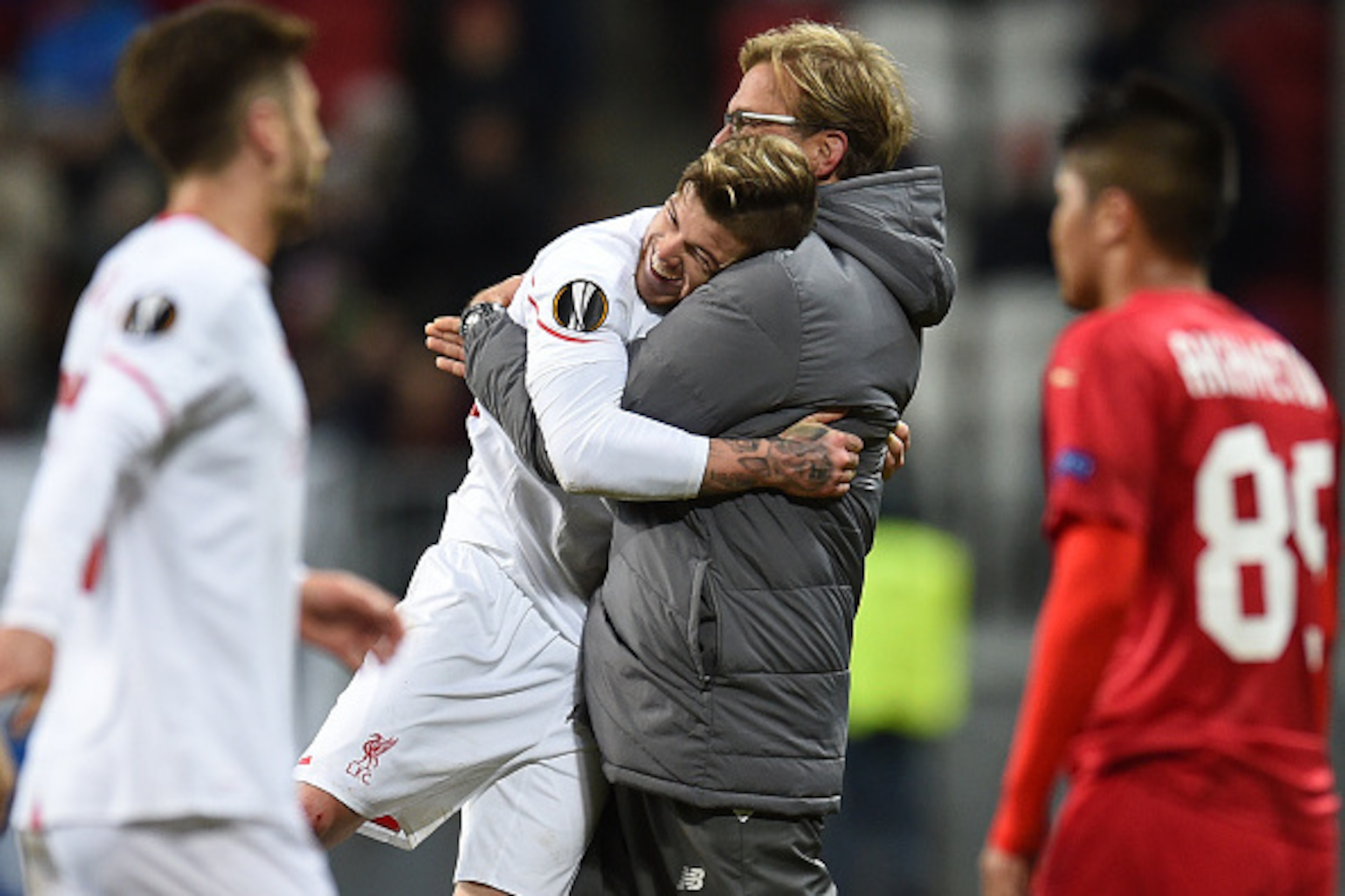 KAZAN, RUSSIA - NOVEMBER 05: Head coach Jurgen Klopp (R) and Alberto Moreno of Liverpool FC celebrate after their victory over FC Rubin Kazan in the UEFA Europa League group B match between FC Rubin Kazan and Liverpool FC at the Kazan Arena Stadium on Nov