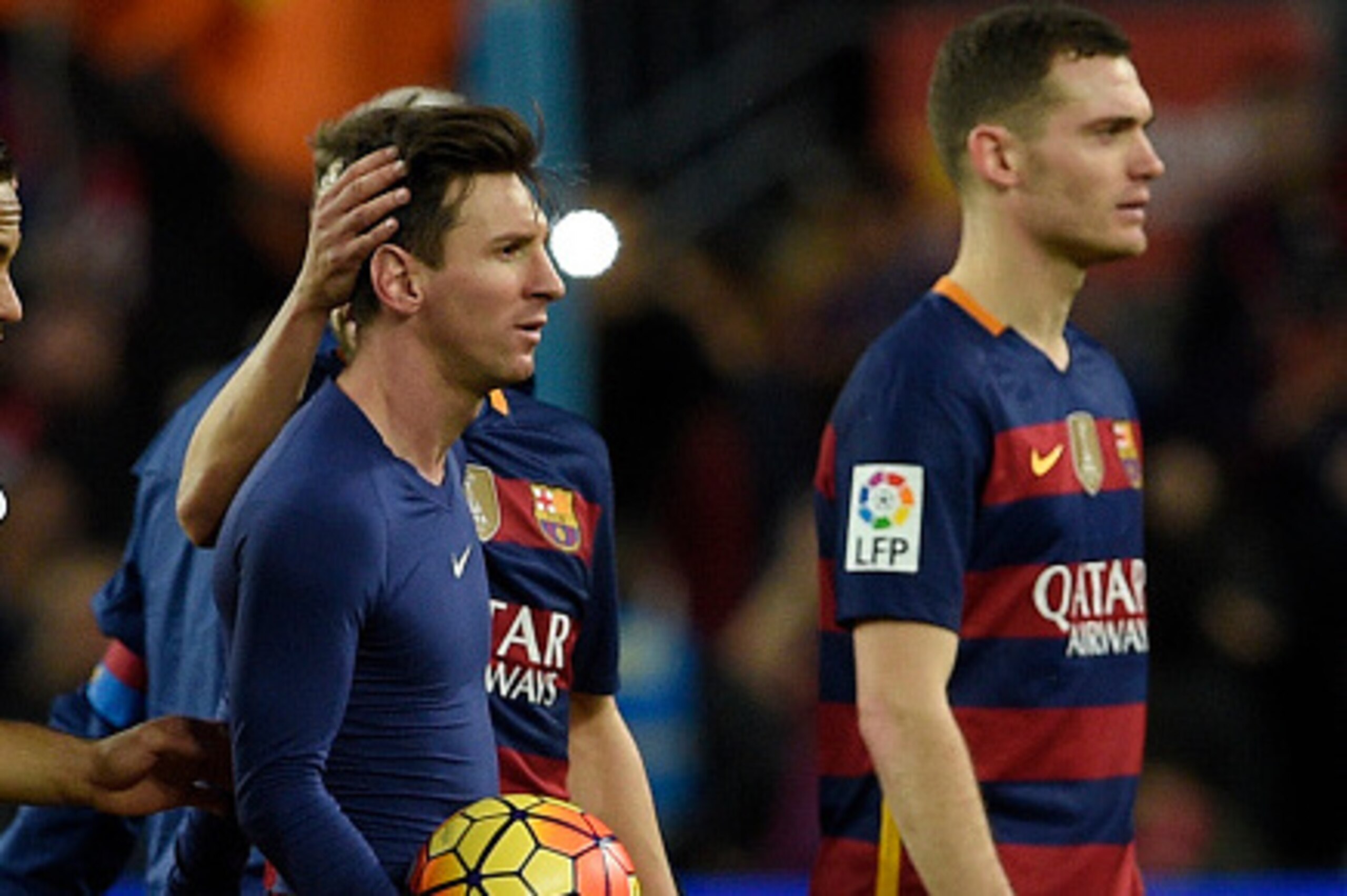 Barcelona's Argentinian forward Lionel Messi is congratuled by teammates after his hat-trick next to Barcelona's Brazilian forward Neymar (L) and Barcelona's Belgian defender Thomas Vermaelen (R) at the end of the Spanish league football match FC Barcelon
