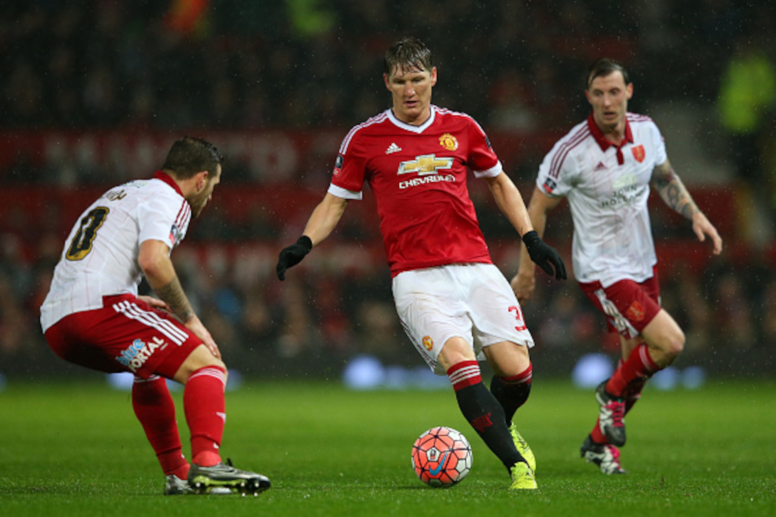MANCHESTER, ENGLAND - JANUARY 09:  Bastian Schweinsteiger of Manchester United takes on Billy Sharp of Sheffield United during the Emirates FA Cup Third Round match between Manchester United and Sheffield United at Old Trafford on January 9, 2016 in Manch