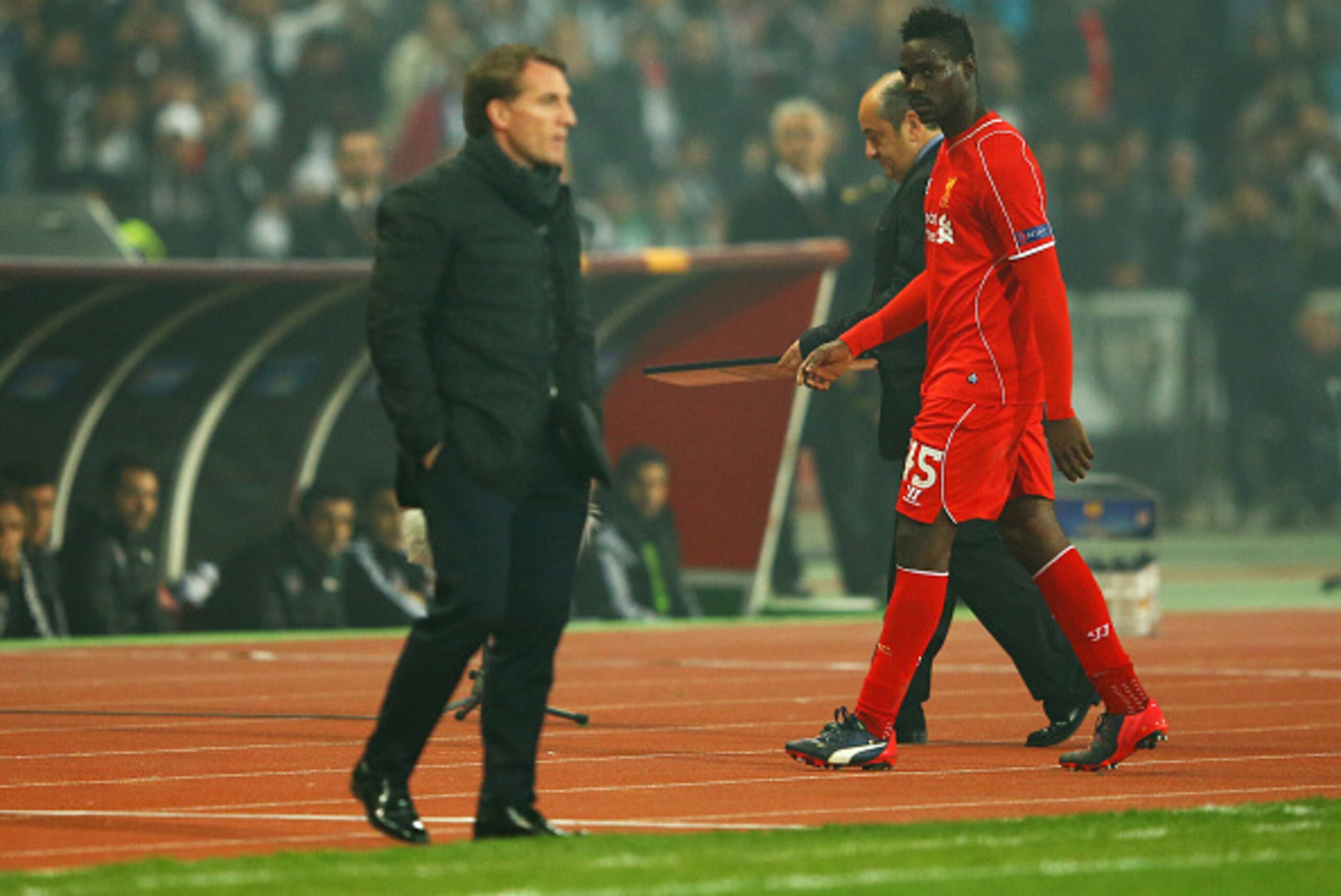 ISTANBUL, TURKEY - FEBRUARY 26:  Mario Balotelli of Liverpool looks across as Brendan Rodgers manager of Liverpool as he is substituted during the UEFA Europa League Round of 32 second leg match between Besiktas JK and Liverpool FC on February 26, 2015 in