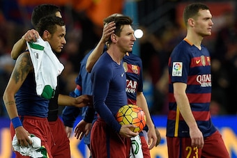 Barcelona's Argentinian forward Lionel Messi is congratuled by teammates after his hat-trick next to Barcelona's Brazilian forward Neymar (L) and Barcelona's Belgian defender Thomas Vermaelen (R) at the end of the Spanish league football match FC Barcelon