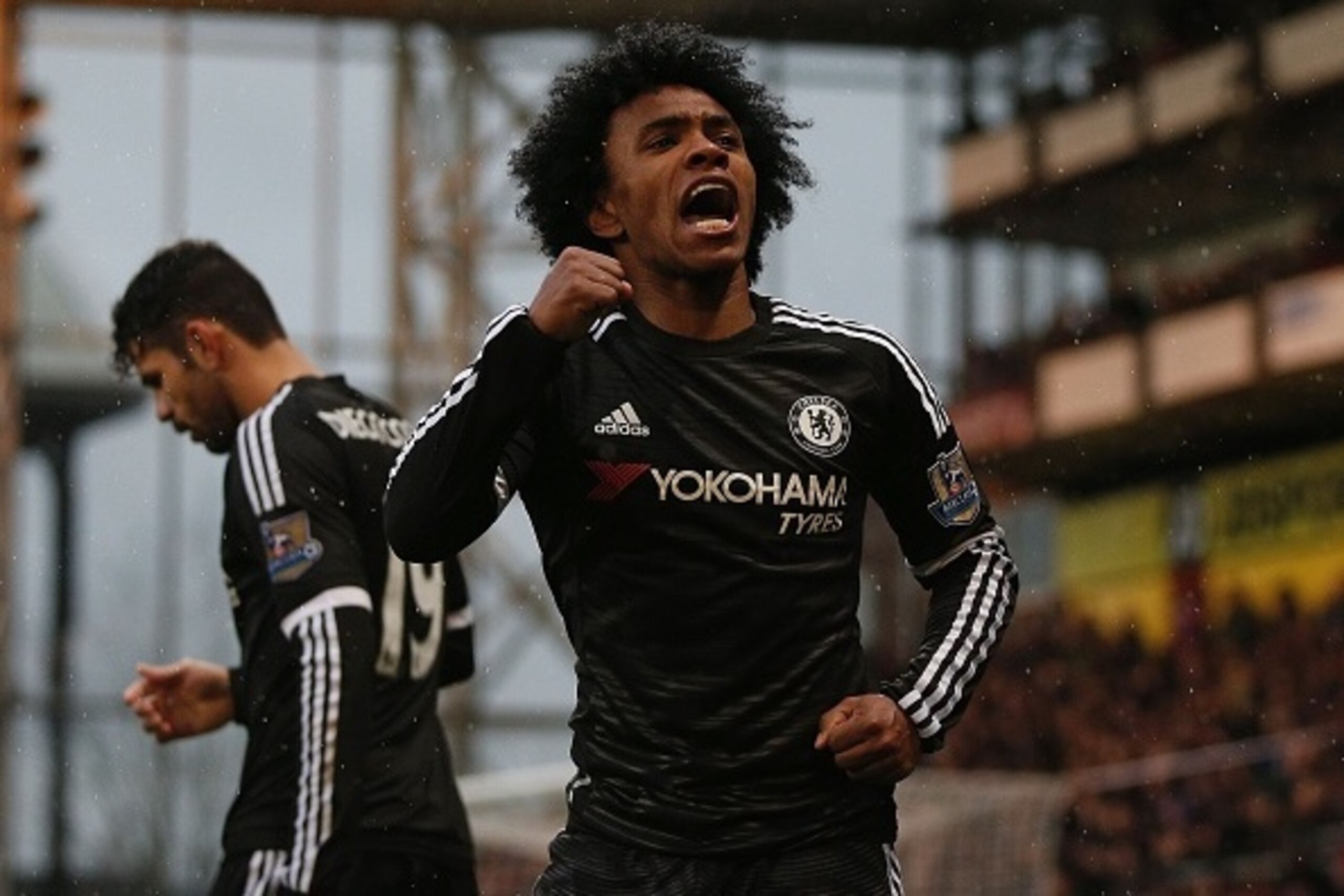 Chelsea's Brazilian midfielder Willian celebrates scoring his team's second goal during the English Premier League football match between Crystal Palace and Chelsea at Selhurst Park in south London on January 3, 2016. AFP PHOTO / ADRIAN DENNIS

RESTRICTED