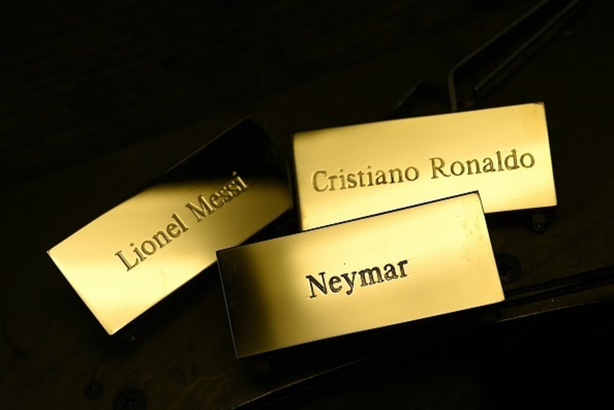 A picture taken on December 15, 2015 shows three plaques reading, 'Cristiano Ronaldo', 'Lionel Messi' and 'Neymar' at the Mellerio jewellers in Paris, as part of the crafting of the Ballon d'Or 2015 Fifa award.
Barcelona's Argentinian forward Lionel Messi