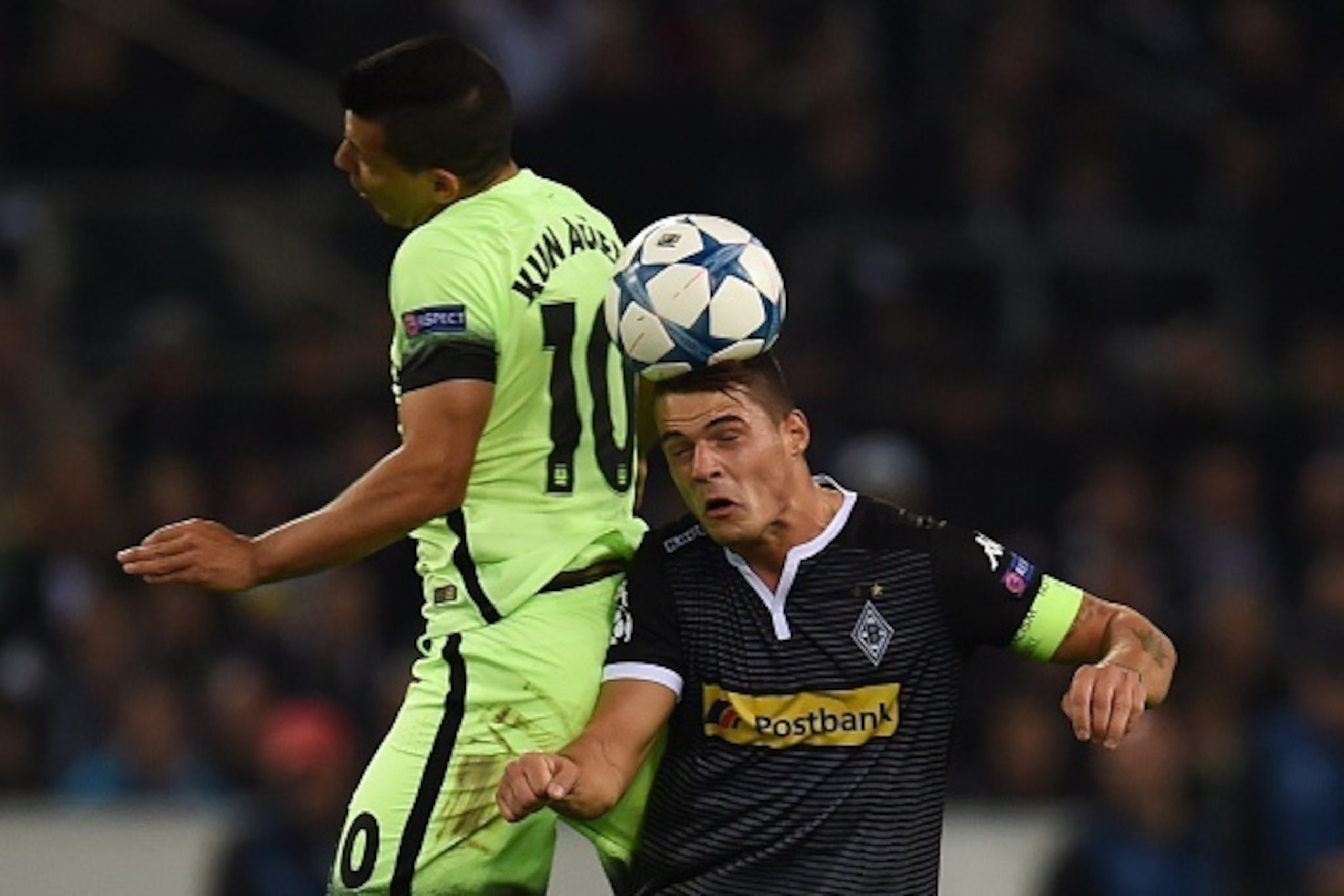 Moenchengladbach's Swiss midfielder Granit Xhaka vies with Manchester City's Argentinian forward Sergio Aguero (L) during the UEFA Champions League first-leg Group D football match between Borussia Monchengladbach and Manchester City in Monchengladbach, w