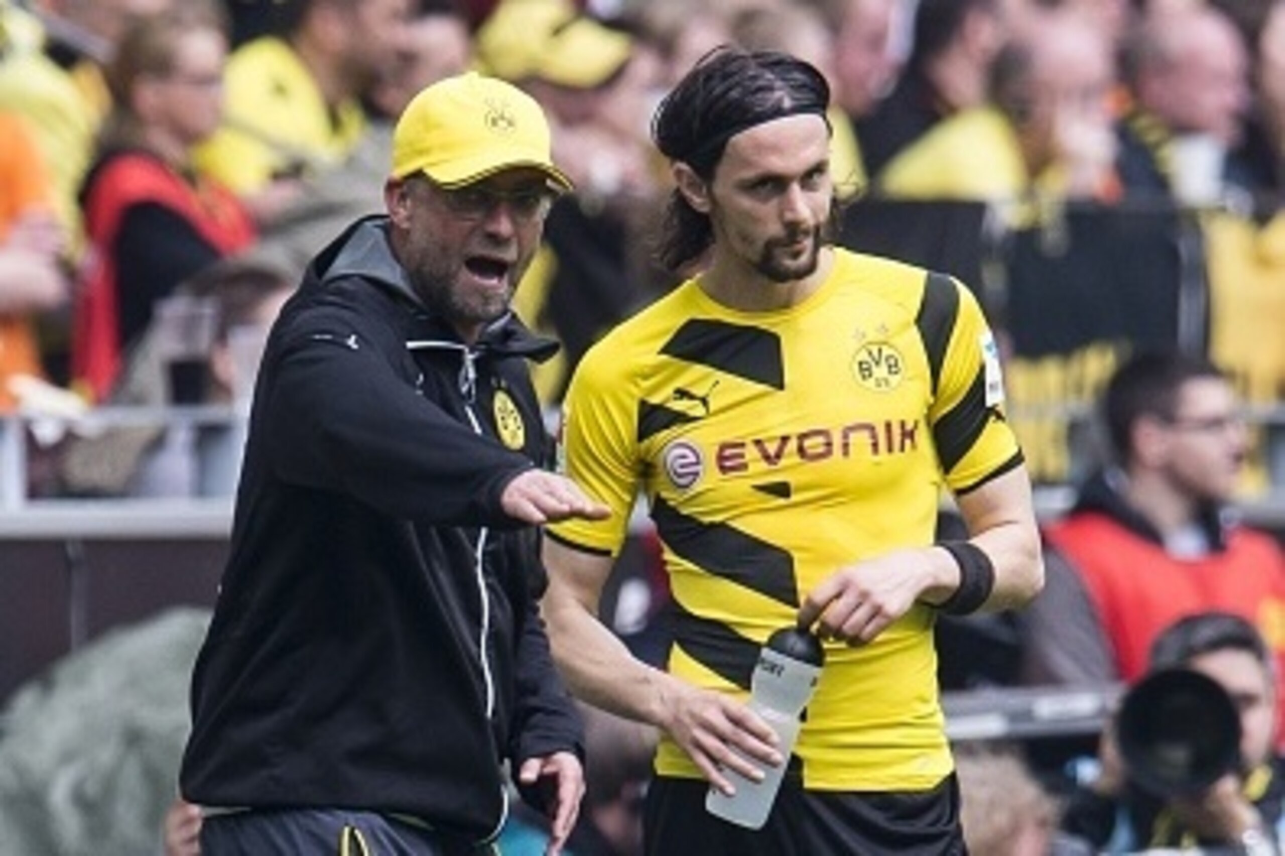 coach Jurgen Klopp of Borussia Dortmund give instructions to Neven Subotic of Borussia Dortmund during the Bundesliga match between Borussia Dortmund and Werder Bremen on May 23, 2015 at the Signal Iduna Park in Dortmund, Germany.(Photo by VI Images via G