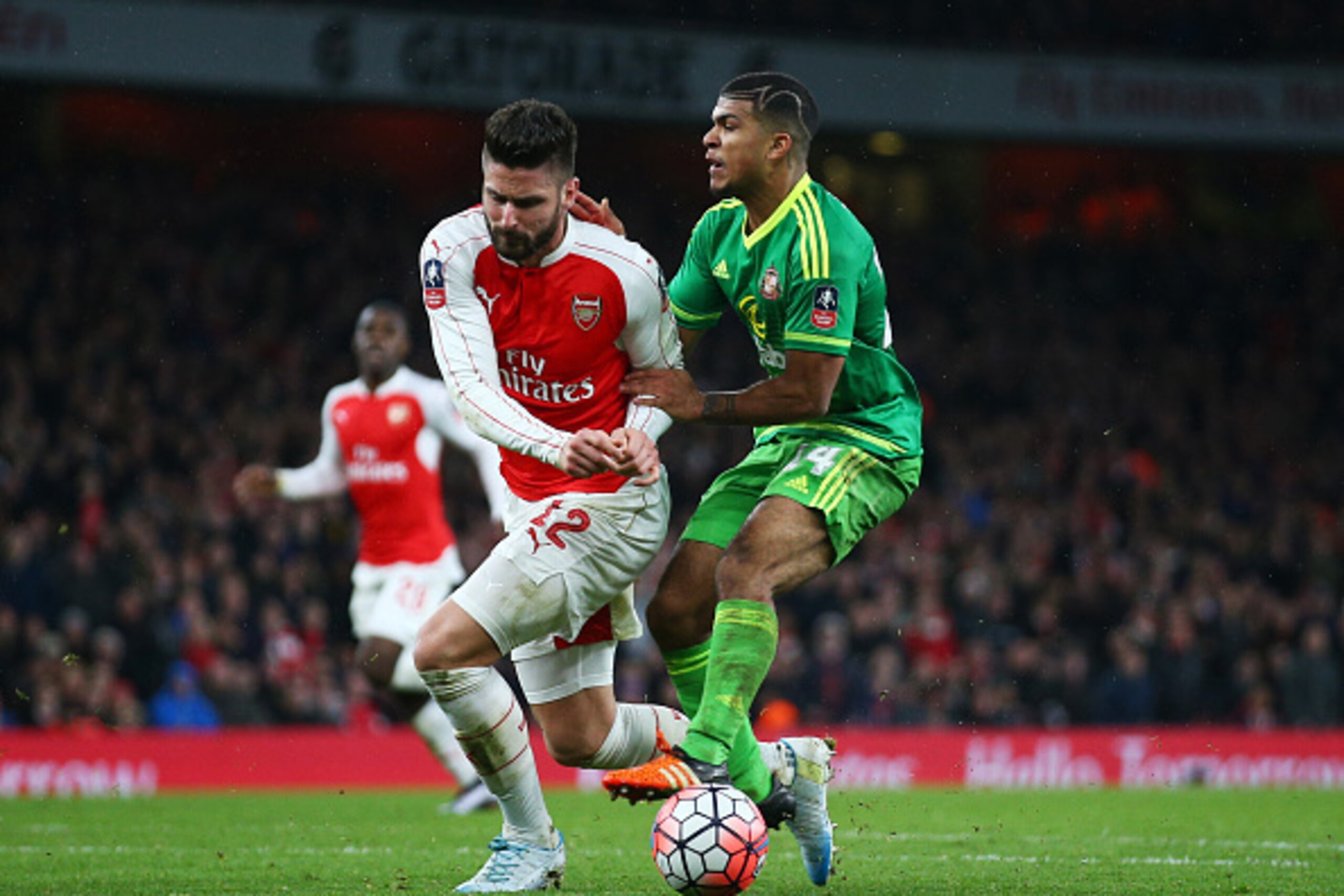 LONDON, ENGLAND - JANUARY 09:  Olivier Giroud of Arsenal is challenged by DeAndre Yedlin of Sunderland in the penalty area during the Emirates FA Cup Third Round match between Arsenal and Sunderland at Emirates Stadium on January 9, 2016 in London, Englan