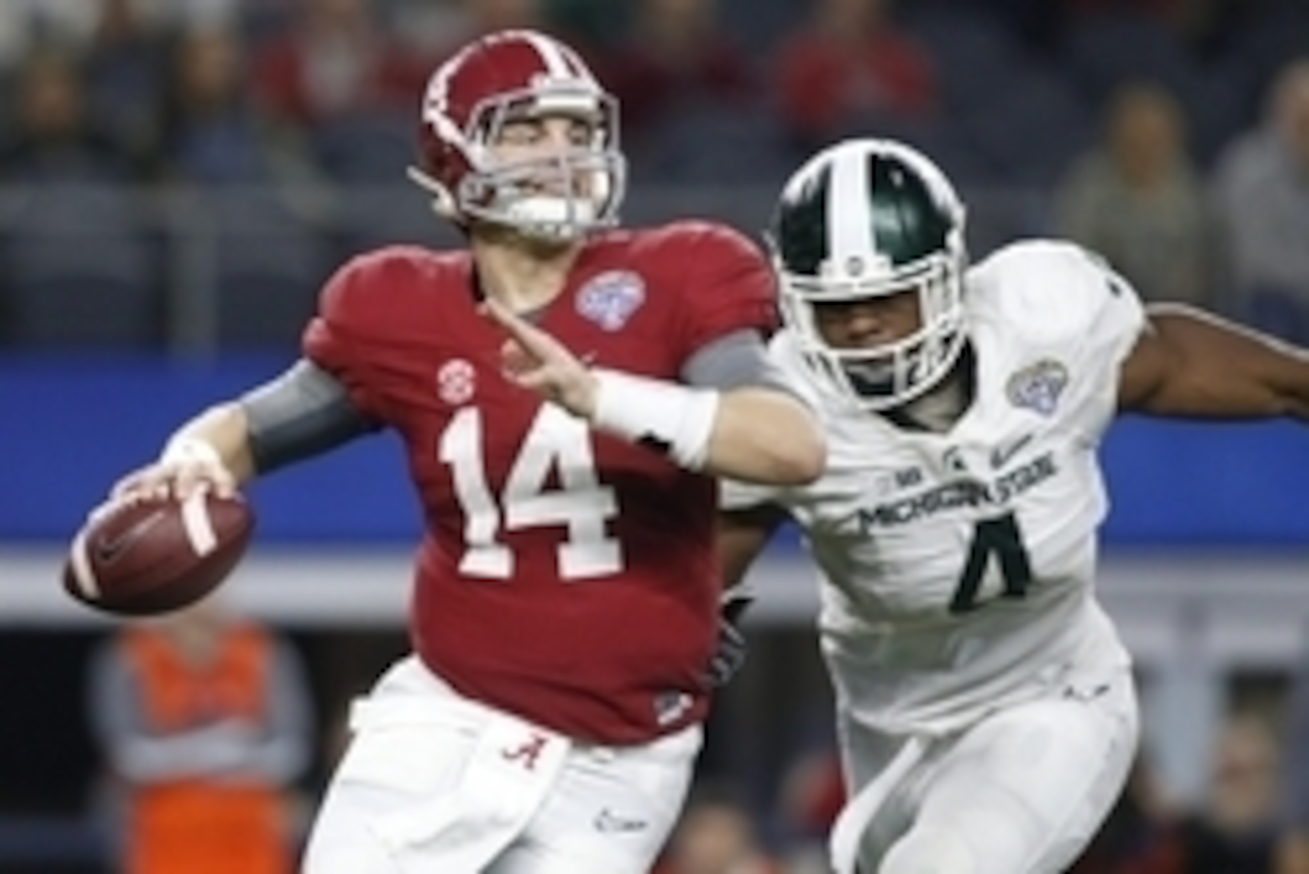 Dec 31, 2015; Arlington, TX, USA; Alabama Crimson Tide quarterback Jake Coker (14) is pressured by Michigan State Spartans defensive lineman Malik McDowell (4) in the third quarter in the 2015 CFP semifinal at the Cotton Bowl at AT&T Stadium. Mandatory Cr