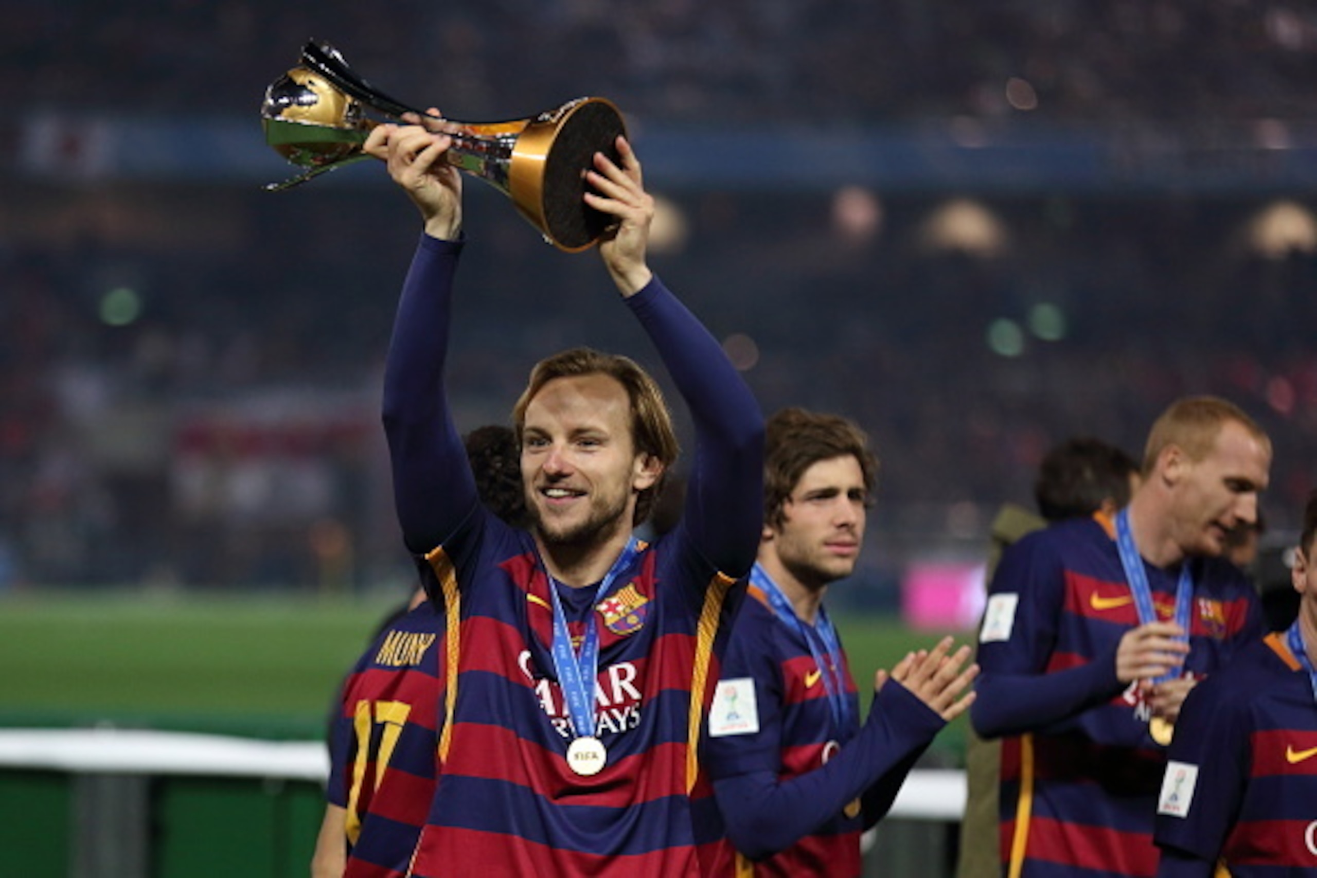 YOKOHAMA, JAPAN - DECEMBER 20:  Ivan Rakitic of FC Barcelona holding the FIFA Club World Cup Trophy during the FIFA Club World Cup Final Match between FC Barcelona and River Plate at International Stadium Yokohama on December 20, 2015 in Yokohama, Japan. 