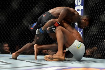 LAS VEGAS, NEVADA - DECEMBER 10:  (Top) Aljamain Sterling grapples with Johnny Eduardo in their bantamweight bout during the UFC Fight Night event at The Chelsea at the Cosmopolitan of Las Vegas on December 10, 2015 in Las Vegas, Nevada.  (Photo by Brando