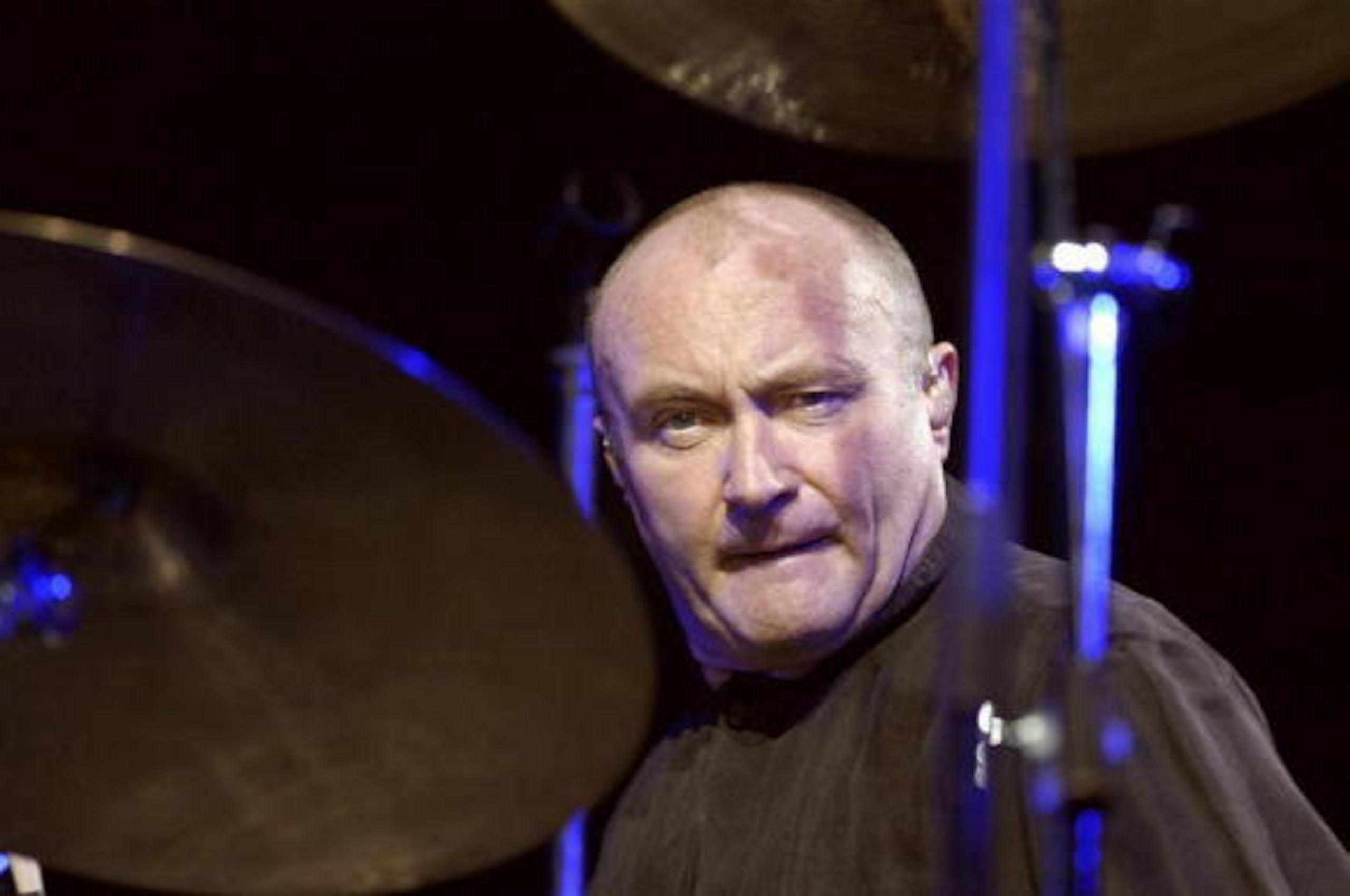 PARIS, FRANCE: British popstar Phil Collins performs 16 June 2004 at Bercy music hall in Paris. AFP PHOTO BERTRAND GUAY (Photo credit should read BERTRAND GUAY/AFP/Getty Images) PARIS, FRANCE: British popstar Phil Collins performs 16 June 2004 at Bercy music hall in Paris. AFP PHOTO BERTRAND GUAY (Photo credit should read BERTRAND GUAY/AFP/Getty Images)