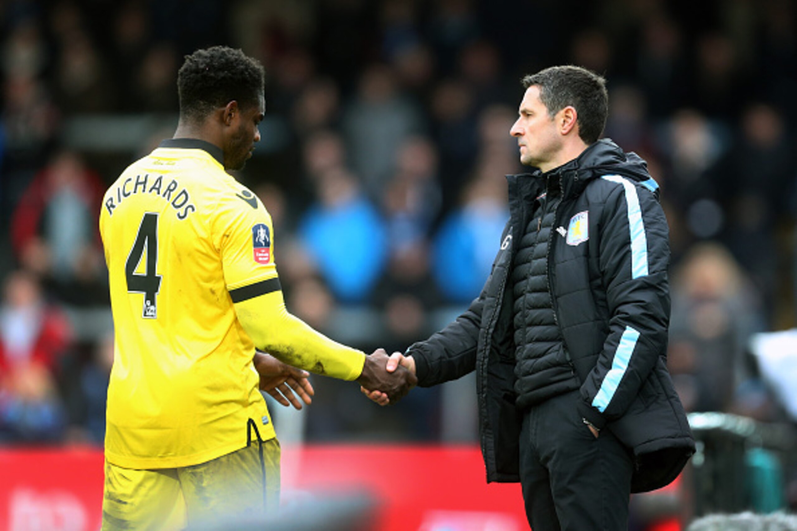 HIGH WYCOMBE, ENGLAND - JANUARY 09: Remi Garde manager of Aston Villa shakes hands with Micah Richards of Aston Villa as he comes off during the Emirates FA Cup Third Round match between Wycombe Wanderers and Aston Villa at Adams Park on January 9, 2016 HIGH WYCOMBE, ENGLAND - JANUARY 09: Remi Garde manager of Aston Villa shakes hands with Micah Richards of Aston Villa as he comes off during the Emirates FA Cup Third Round match between Wycombe Wanderers and Aston Villa at Adams Park on January 9, 2016
