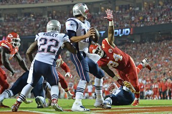 KANSAS CITY, MO - SEPTEMBER 29:  Defensive linemen Kevin Vickerson #94 of the Kansas City Chiefs pressures quarterback Tom Brady #12 of the New England Patriots during the second half on September 29, 2014 at Arrowhead Stadium in Kansas City, Missouri.  (