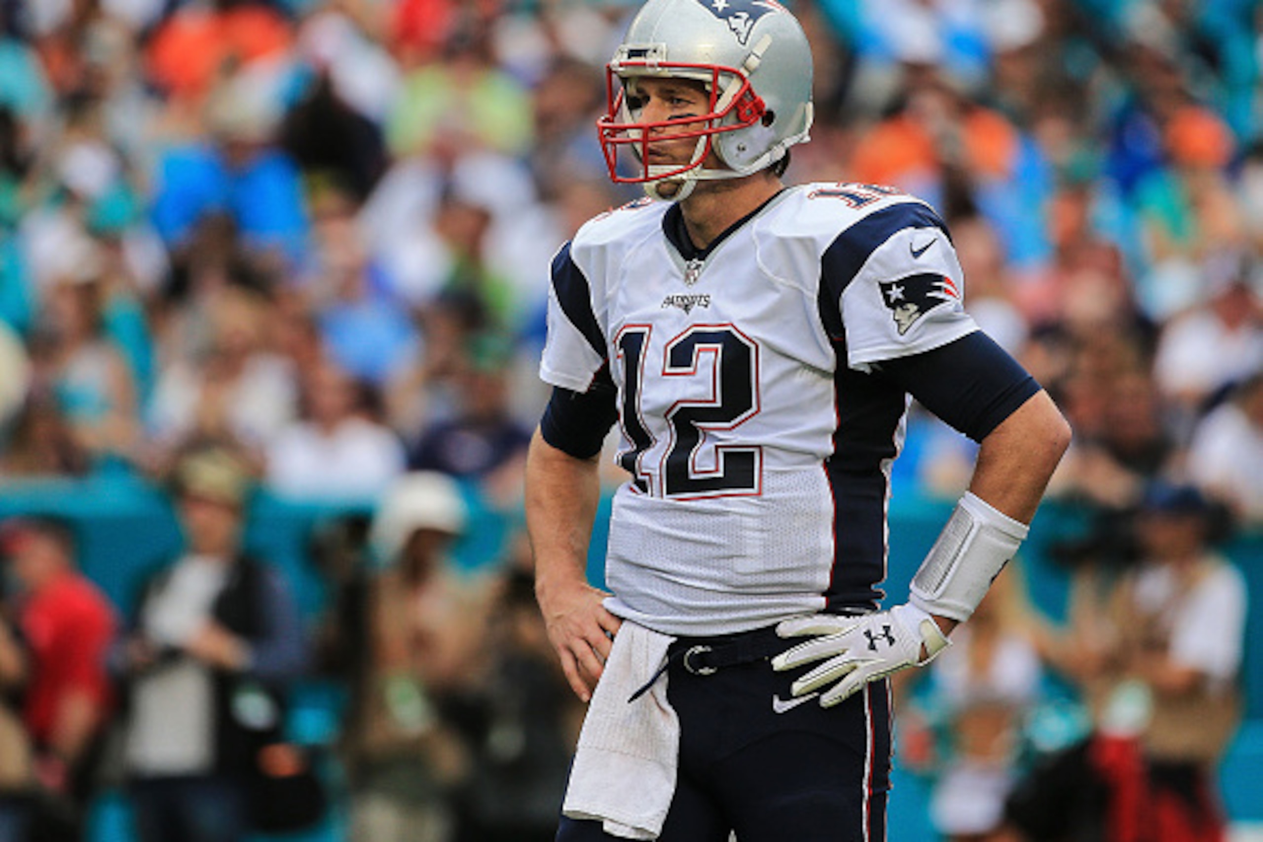 MIAMI GARDENS, FL - JANUARY 03: Tom Brady #12 of the New England Patriots looks on during the third quarter of the game against the Miami Dolphins at Sun Life Stadium on January 3, 2016 in Miami Gardens, Florida. (Photo by Mike Ehrmann/Getty Images)