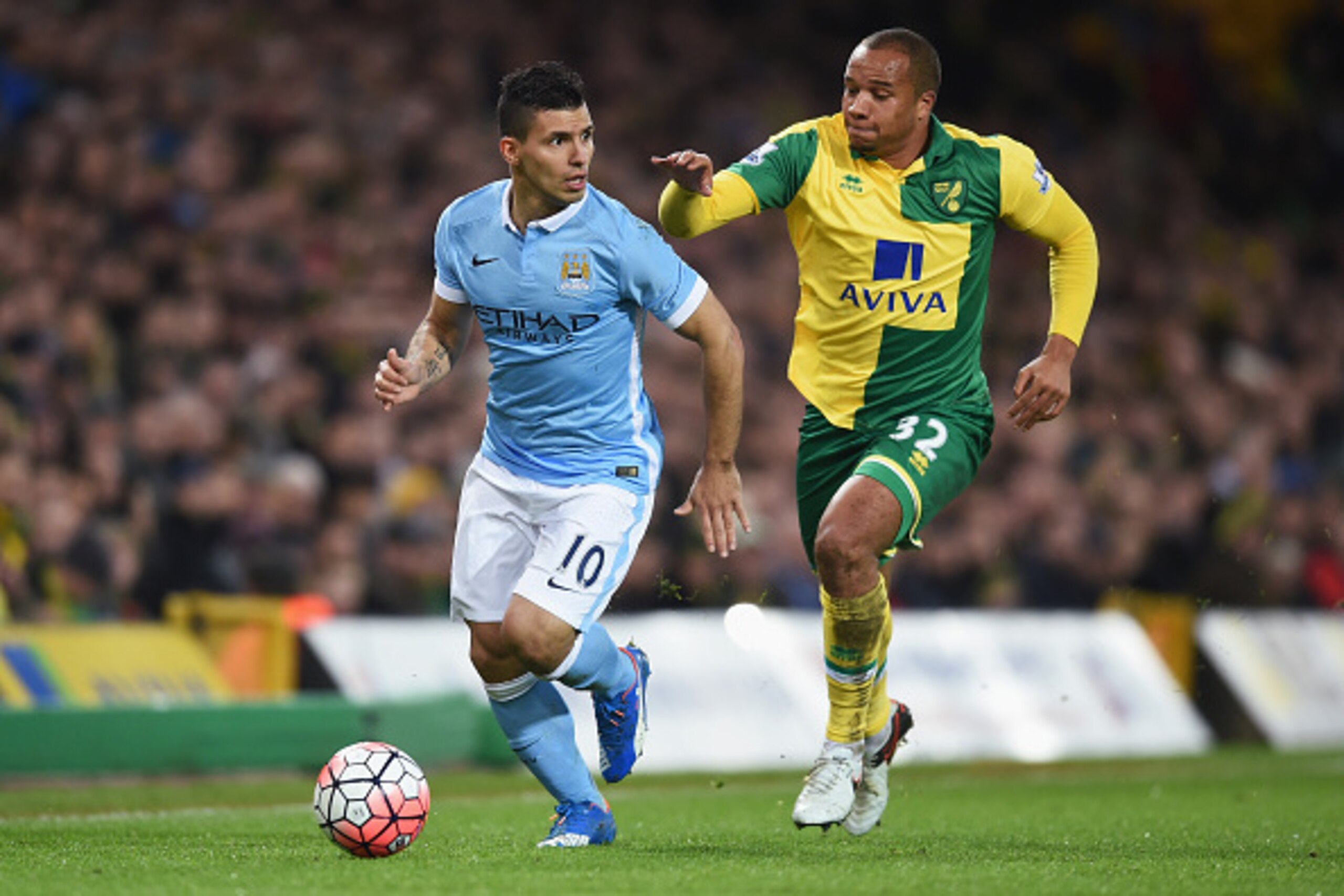 NORWICH, ENGLAND - JANUARY 09:  Sergio Aguero of Manchester City and Vadis Odjidja Ofoe of Norwich City compete for the ball during the Emirates FA Cup third round match between Norwich City and Manchester City at Carrow Road on January 9, 2016 in Norwich