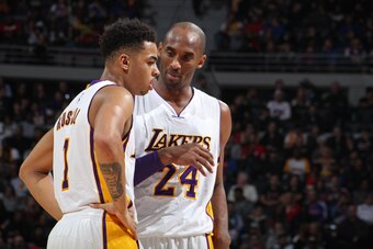AUBURN HILLS, MI - DECEMBER 6:  Kobe Bryant #24 and D'Angelo Russell #1 of the Los Angeles Lakers talk during the game against the Detroit Pistons on December 6, 2015 at The Palace of Auburn Hills in Auburn Hills, Michigan. NOTE TO USER: User expressly ac