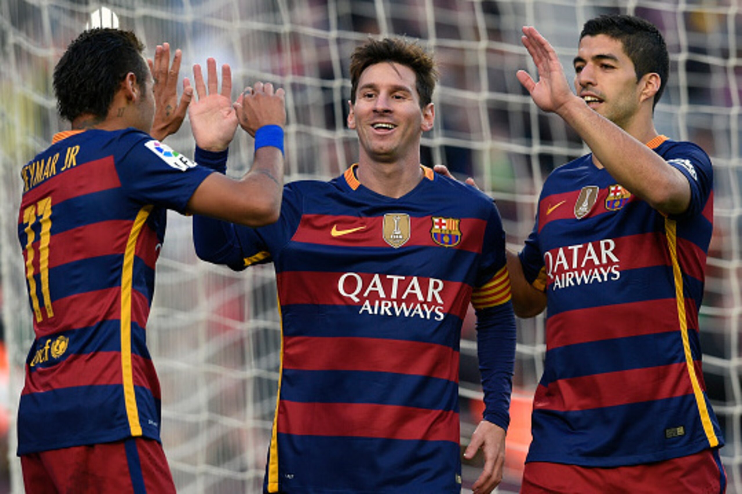Barcelona's Argentinian forward Lionel Messi (C) celebrates a goal with Barcelona's Brazilian forward Neymar (L) and Barcelona's Uruguayan forward Luis Suarez (R) during the Spanish league football match FC Barcelona vs Granada CF at the Camp Nou stadium 
