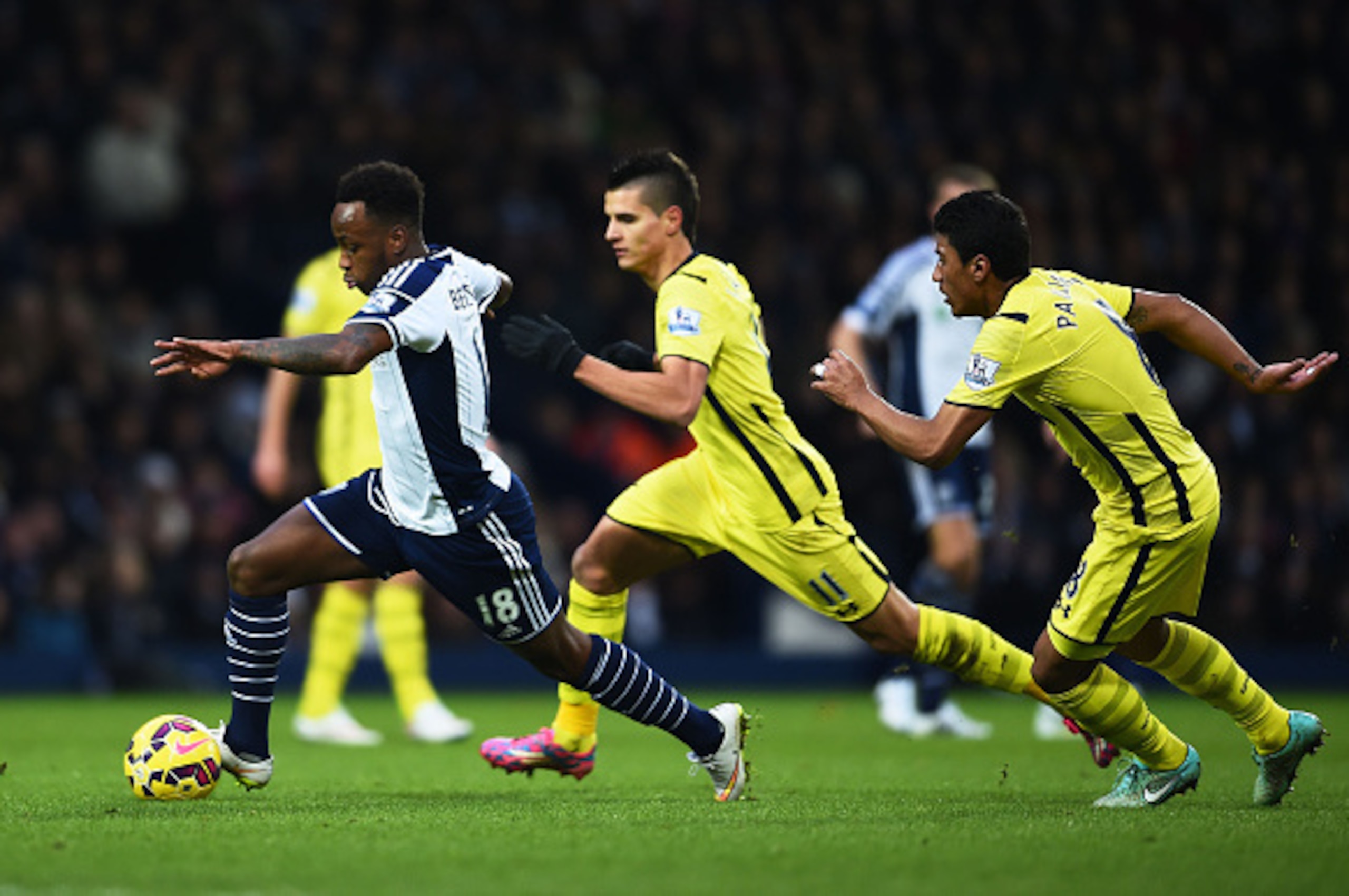 WEST BROMWICH, ENGLAND - JANUARY 31:  Saido Berahino of West Brom goes past Erik Lamela and Paulinho of Spurs during the Barclays Premier League match between West Bromwich Albion and Tottenham Hotspur at The Hawthorns on January 31, 2015 in West Bromwich