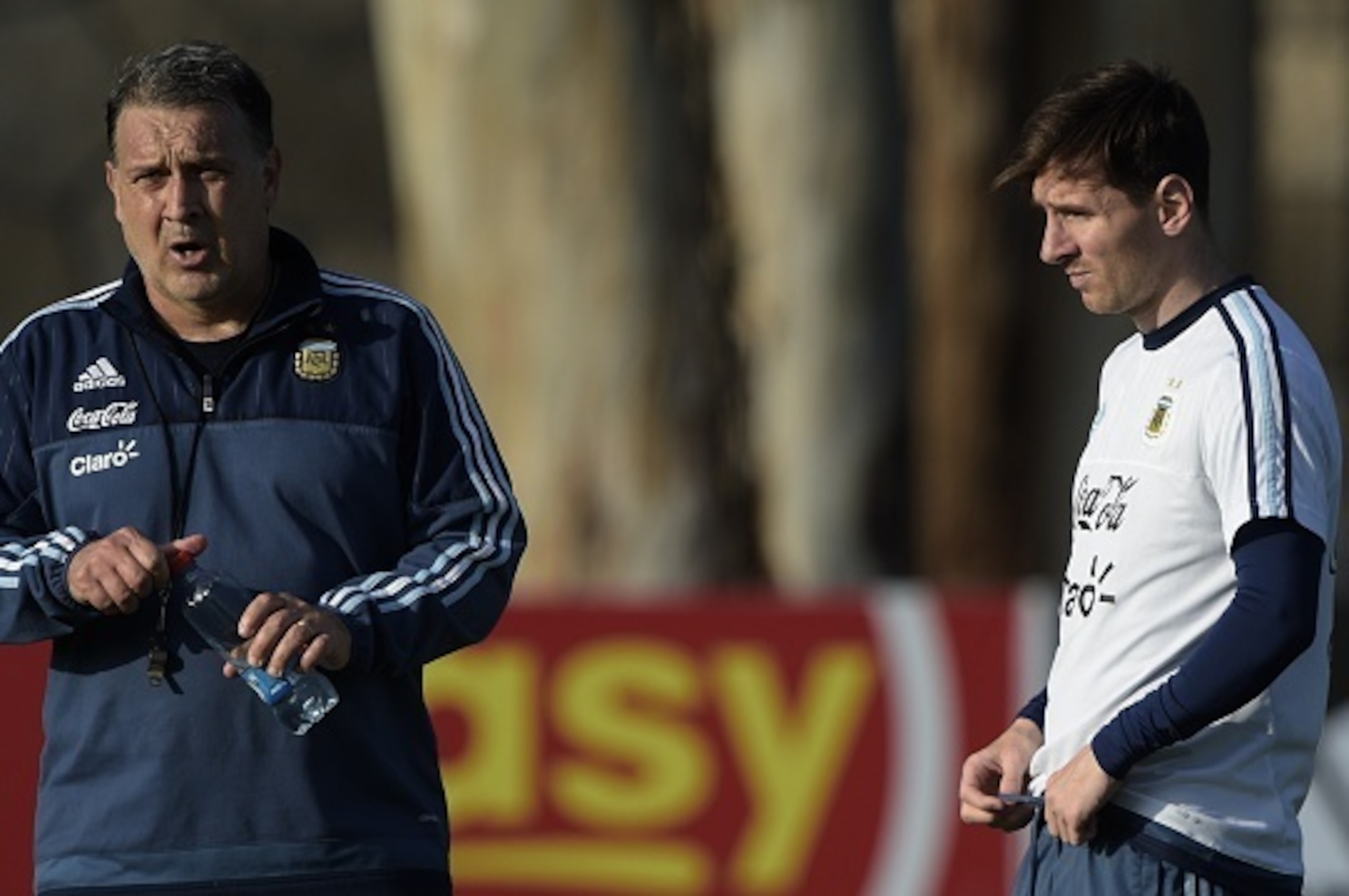 Argentina's forward Lionel Messi (R) listens to coach Gerardo Martino during a training session in La Serena, Coquimbo, Chile, on June 23, 2015 ahead the Copa America quarterfinal football match against Colombia to be held in Vina del Mar on June 26. AFP 