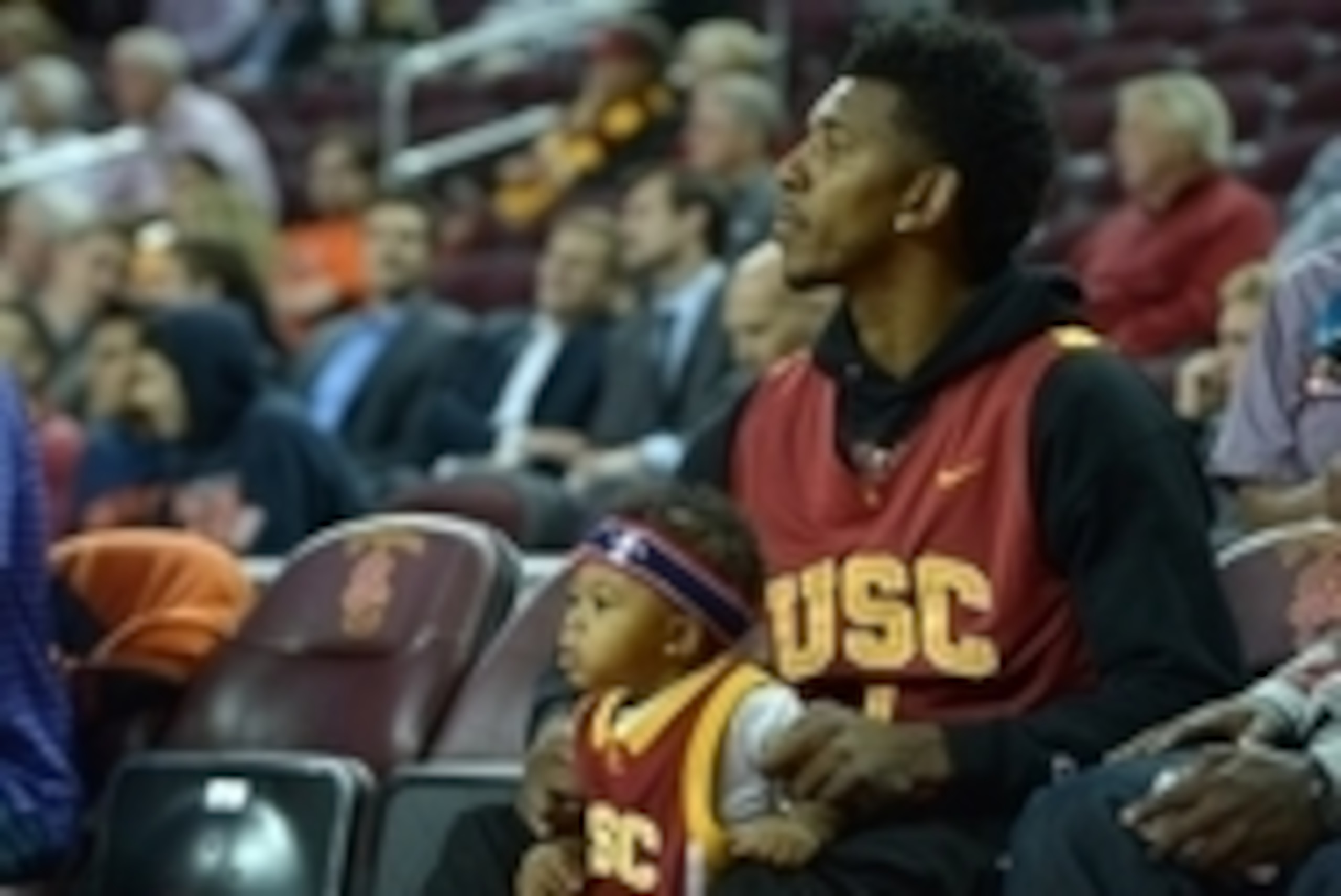 Nov 19, 2013; Los Angeles, CA, USA; Los Angeles Lakers guard Nick Young with son Nick Young Jr. during the game against the Cal State Fullerton Titans at Galen Center. Mandatory Credit: Kirby Lee-USA TODAY Sports