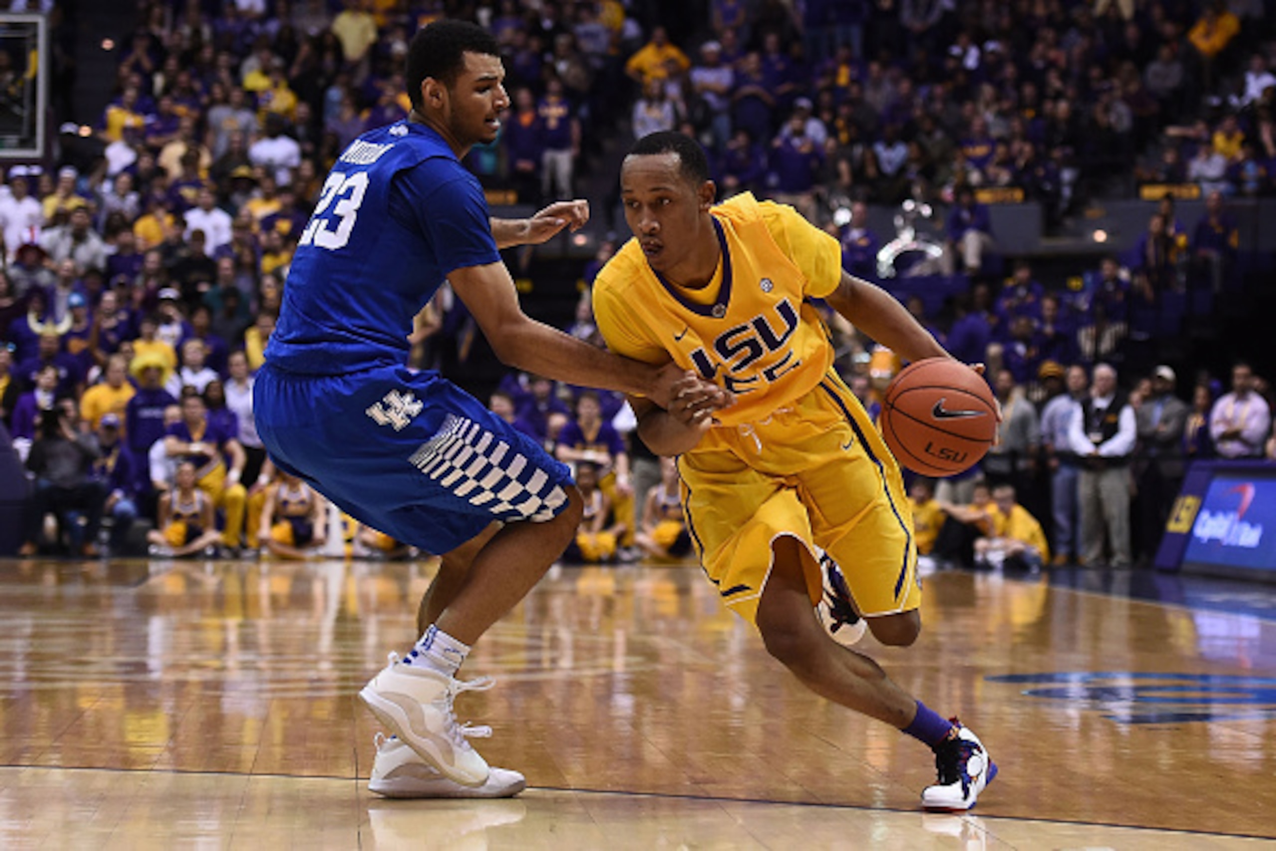 BATON ROUGE, LA - JANUARY 05:  Tim Quarterman #55 of the LSU Tigers drives around Jamal Murray #23 of the Kentucky Wildcats during the second half of a game at the Pete Maravich Assembly Center on January 5, 2016 in Baton Rouge, Louisiana.  LSU defeated K