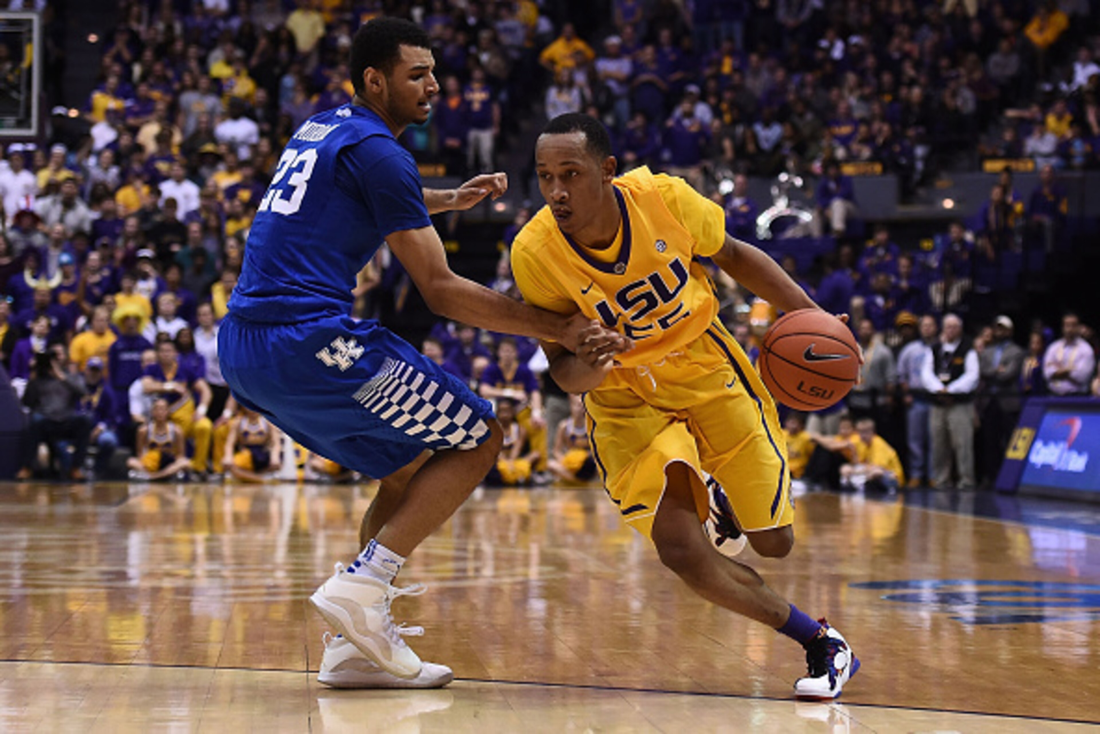BATON ROUGE, LA - JANUARY 05:  Tim Quarterman #55 of the LSU Tigers drives around Jamal Murray #23 of the Kentucky Wildcats during the second half of a game at the Pete Maravich Assembly Center on January 5, 2016 in Baton Rouge, Louisiana.  LSU defeated K