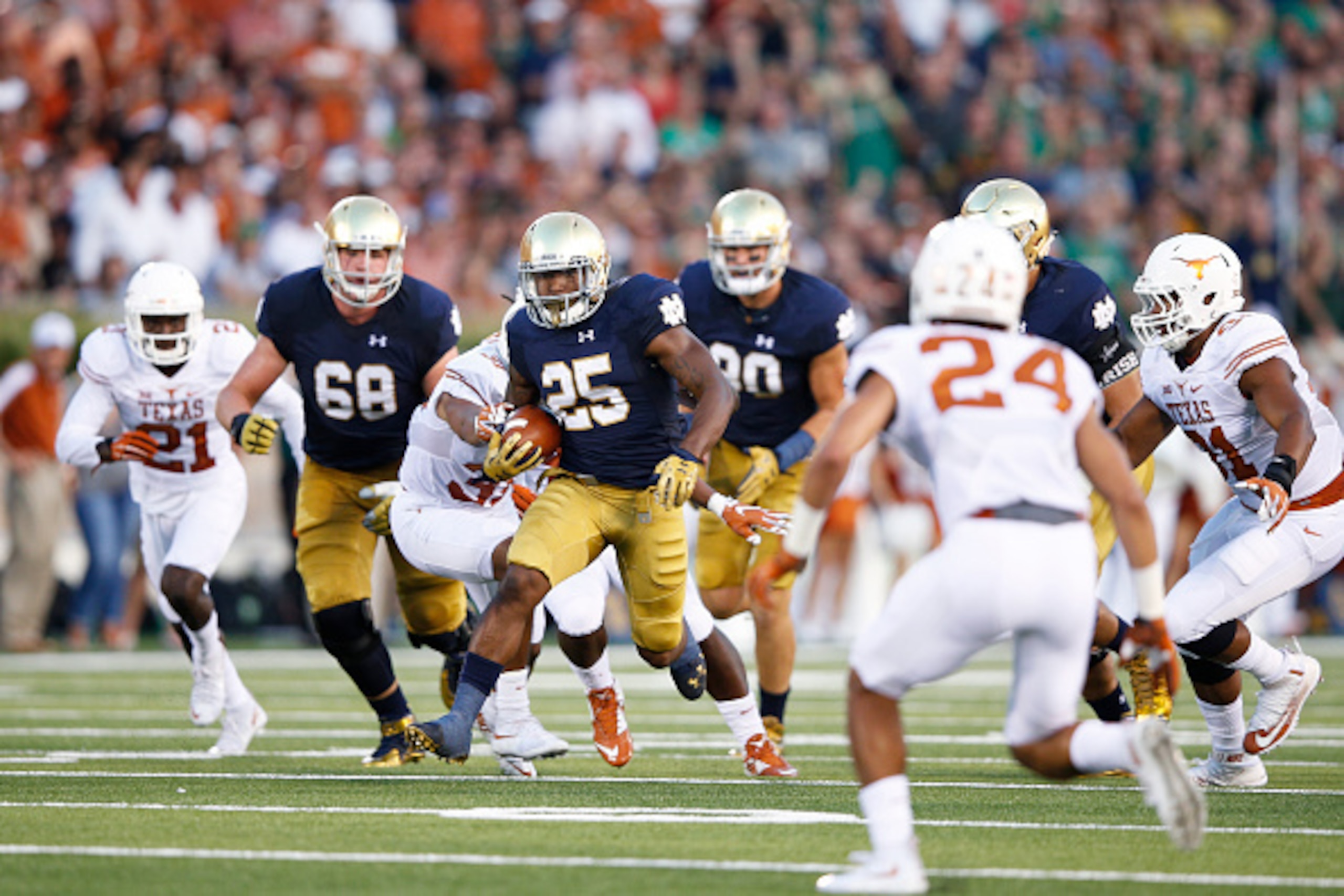 SOUTH BEND, IN - SEPTEMBER 5: Tarean Folston #25 of the Notre Dame Fighting Irish runs the ball during a game against the Texas Longhorns at Notre Dame Stadium on September 5, 2015 in South Bend, Indiana. Notre Dame defeated Texas 38-3. (Photo by Joe Robb