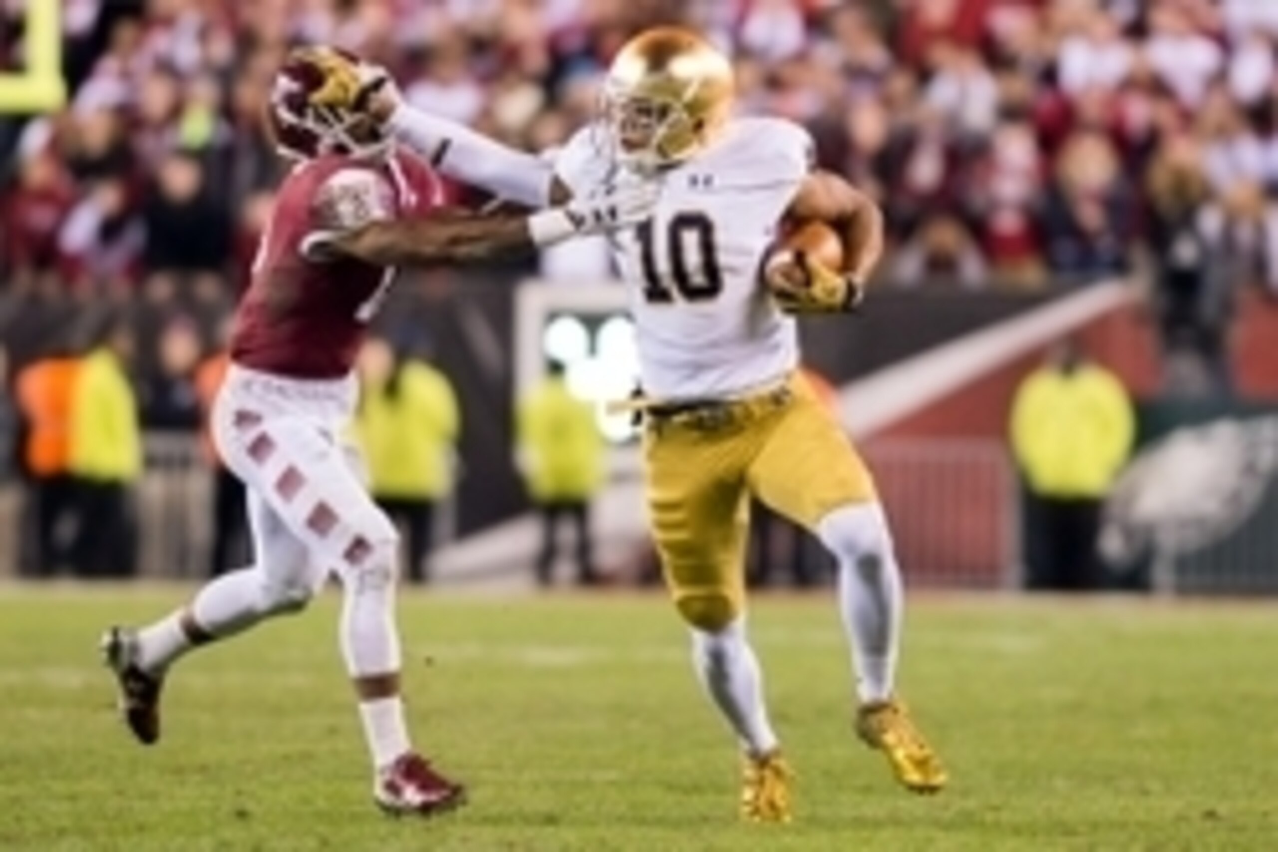 Oct 31, 2015; Philadelphia, PA, USA; Notre Dame Fighting Irish tight end Alize Jones (10) runs after the catch as Temple Owls safety Nate Smith (13) defends in the third quarter at Lincoln Financial Field. Notre Dame won 24-20. Mandatory Credit: Matt Cash