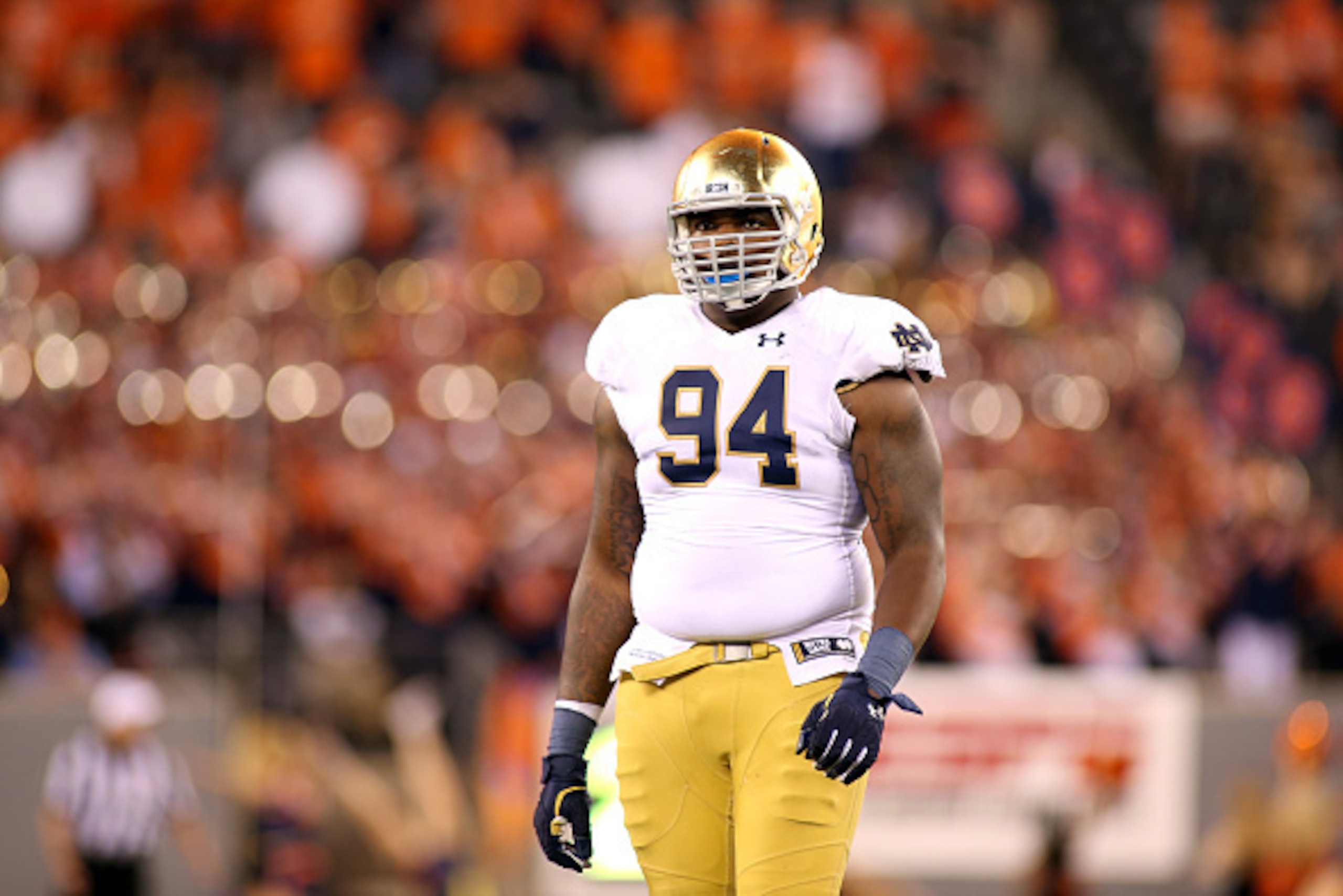 EAST RUTHERFORD, NJ - SEPTEMBER 27:  Jarron Jones #94 of the Notre Dame Fighting Irish looks on against the Syracuse Orange at MetLife Stadium on September 27, 2014 in East Rutherford, New Jersey. Notre Dame won 31-15.  (Photo by Chris Chambers/Getty Imag