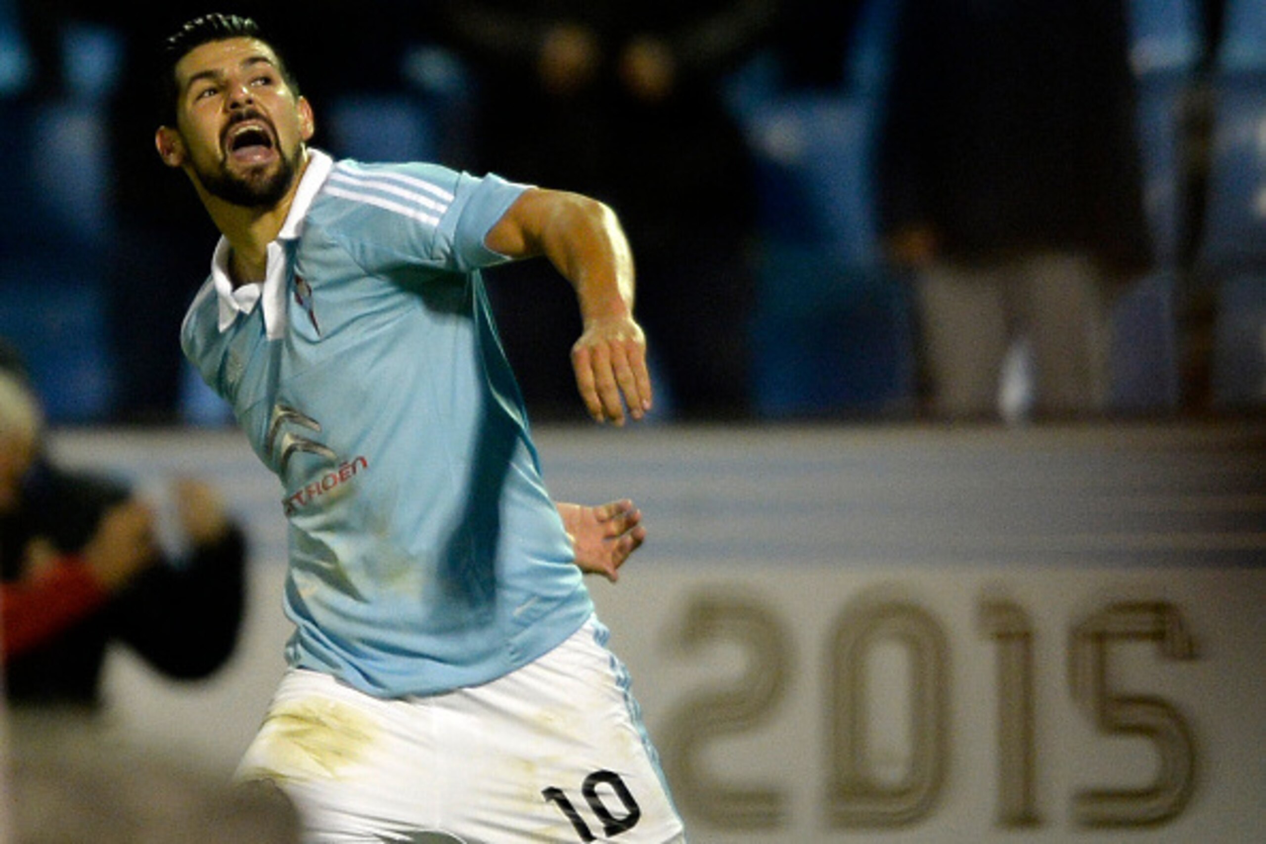 Celta Vigo's forward Nolito celebrates after scoring a goal during the Spanish league football match RC Celta de Vigo vs Real Sporting de Gijon at the Balaidos stadium in Vigo on November 28, 2015.   Celta won the match 2-1. AFP PHOTO/ MIGUEL RIOPA / AFP 