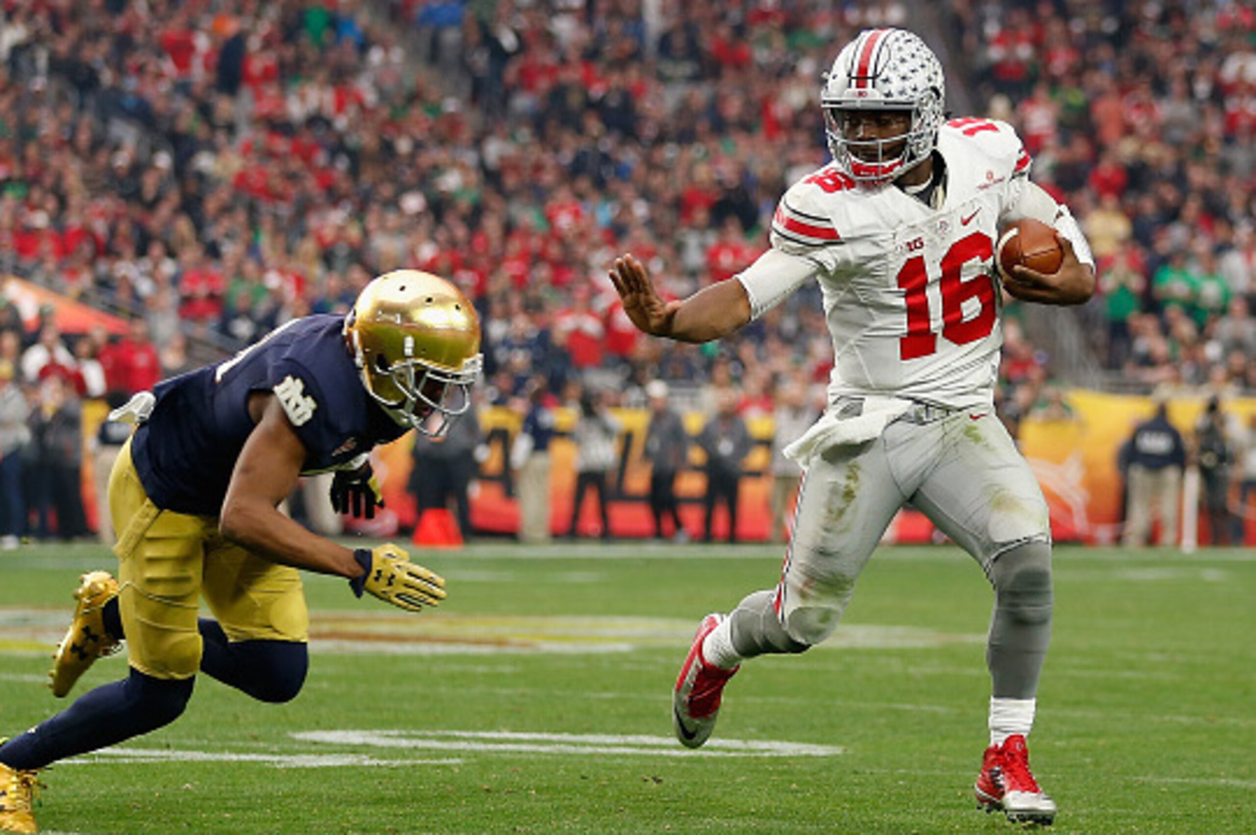 GLENDALE, AZ - JANUARY 01:  Quarterback J.T. Barrett #16 of the Ohio State Buckeyes scrambles with the football against the Notre Dame Fighting Irish during the BattleFrog Fiesta Bowl at University of Phoenix Stadium on January 1, 2016 in Glendale, Arizon