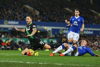 LIVERPOOL, ENGLAND - DECEMBER 28: Marko Arnautovic of Stoke City is fouled by John Stones of Everton resulting in the penalty during the Barclays Premier League match between Everton and Stoke City at Goodison Park on December 28, 2015 in Liverpool, Engla