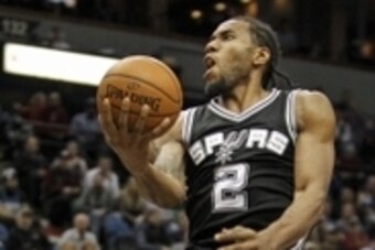 Dec 23, 2015; Minneapolis, MN, USA; San Antonio Spurs forward Kawhi Leonard (2) drives to the basket against the Minnesota Timberwolves in the fourth quarter at Target Center. The Spurs win 108-83. Mandatory Credit: Bruce Kluckhohn-USA TODAY Sports