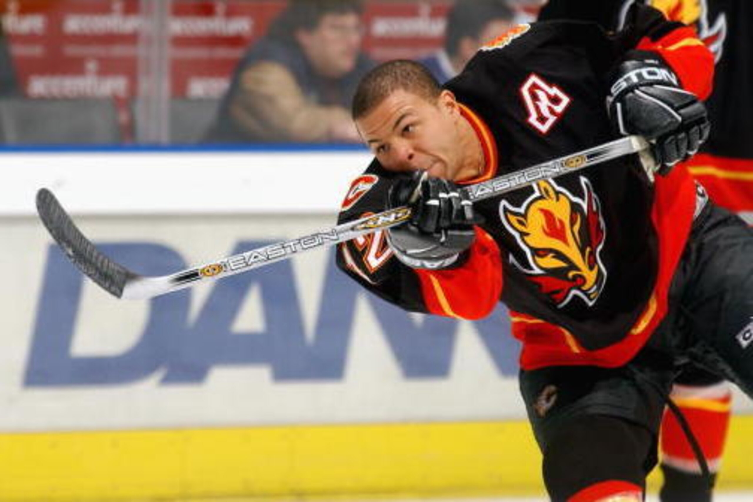 TORONTO - JANUARY 14:  Jarome Iginla #12 of the Calgary Flames fires a puck during the pre-game warmup before facing the Toronto Maple Leafs at Air Canada Centre on January 14, 2003 in Toronto, Ontario. The Leafs defeated the Flames 3-2.  (Photo By Dave S