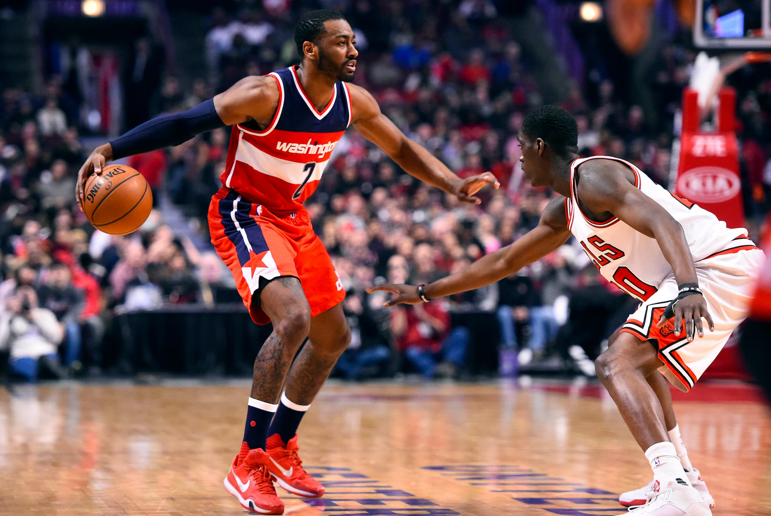 Jan 11, 2016; Chicago, IL, USA; Washington Wizards guard John Wall (2) dribbles the ball against Chicago Bulls forward Tony Snell (20) during the second half at the United Center. The Wizards defeat the Bulls 114-100. Mandatory Credit: Mike DiNovo-USA TOD