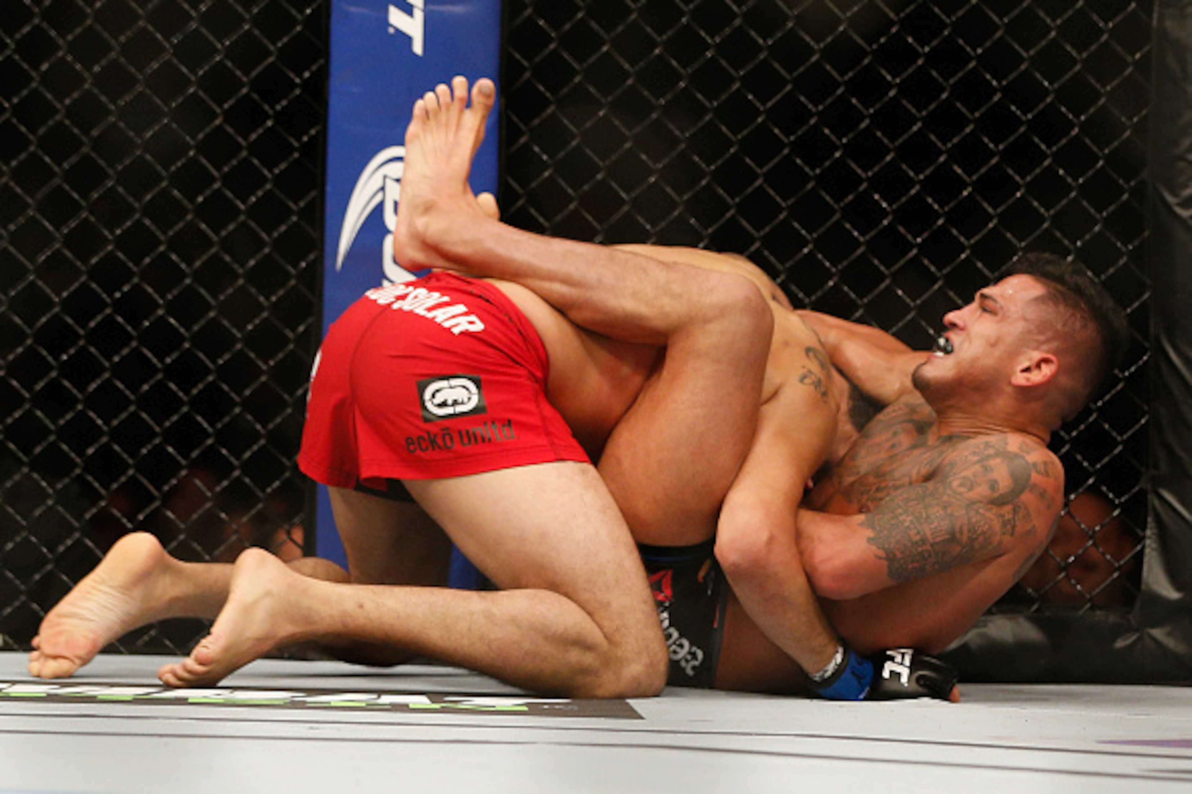 LAS VEGAS, NV - DECEMBER 06:  (R-L) Anthony Pettis submits Gilbert Melendez in their UFC lightweight championship bout during the UFC 181 event inside the Mandalay Bay Events Center on December 6, 2014 in Las Vegas, Nevada.  (Photo by Josh Hedges/Zuffa LL