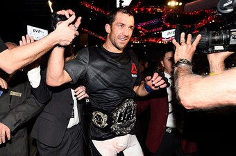LAS VEGAS, NEVADA - DECEMBER 12:  UFC middleweight champion Luke Rockhold celebrates withs fans after defeating Chris Weidman in their middleweight championship bout during the UFC 194 event inside MGM Grand Garden Arena on December 12, 2015 in Las Vegas,