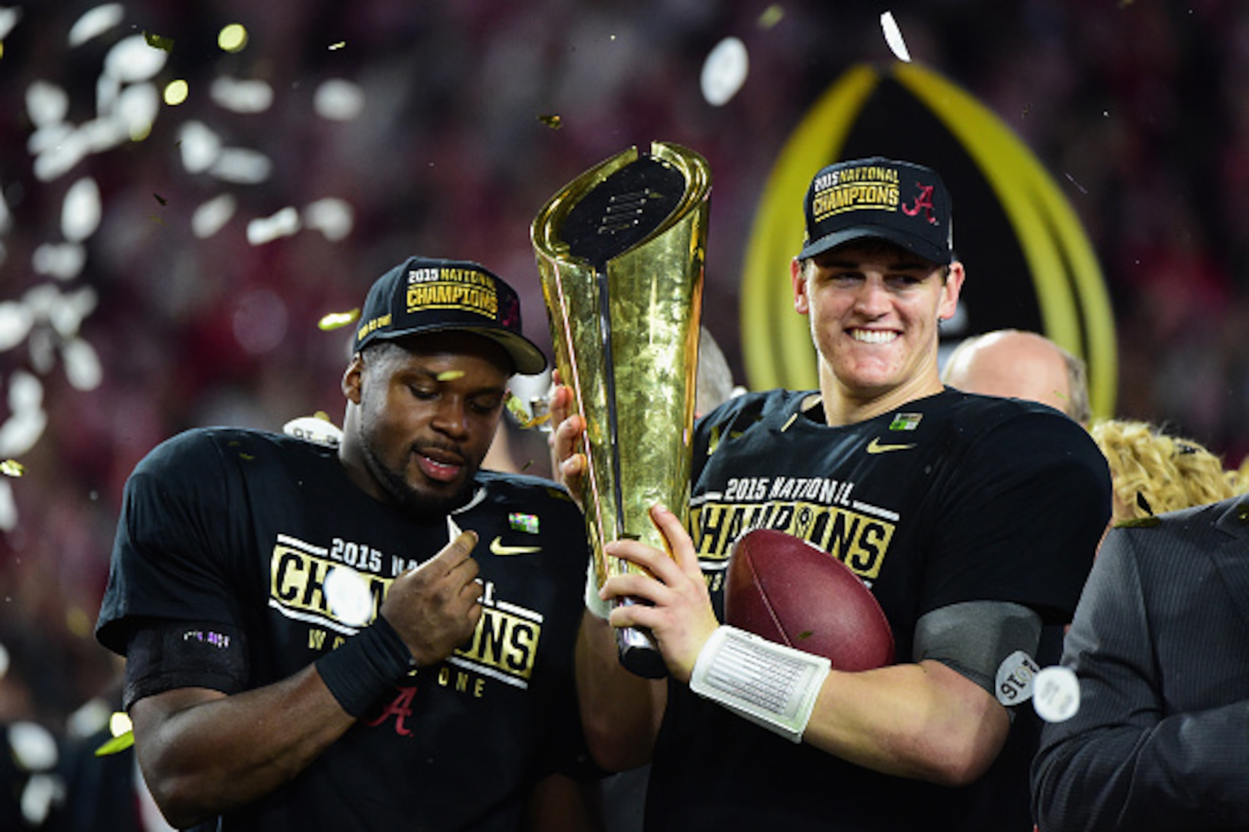 GLENDALE, AZ - JANUARY 11:  Jake Coker #14 of the Alabama Crimson Tide celebrates by hoisting the College Football Playoff National Championship Trophy after defeating the Clemson Tigers in the 2016 College Football Playoff National Championship Game at U