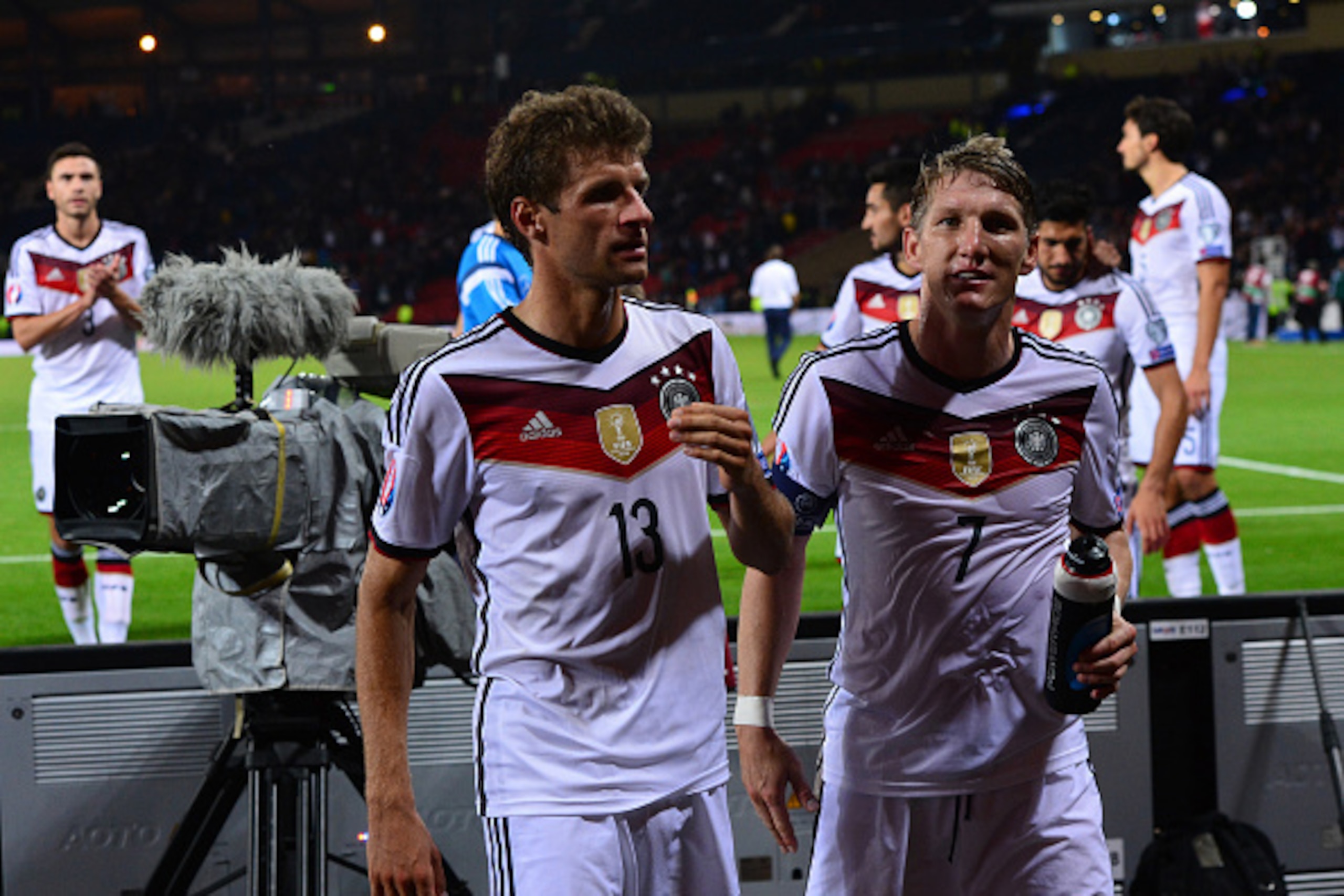 GLASGOW, SCOTLAND - SEPTEMBER 7 : Bastian Schweinsteiger and Thomas Muller of Germany celebrate at the final whistle during the EURO 2016 Qualifier between Scotland and Germany at Hamden Park on September 7, 2015 in Glasgow, Scotland. (Photo by Mark Runna